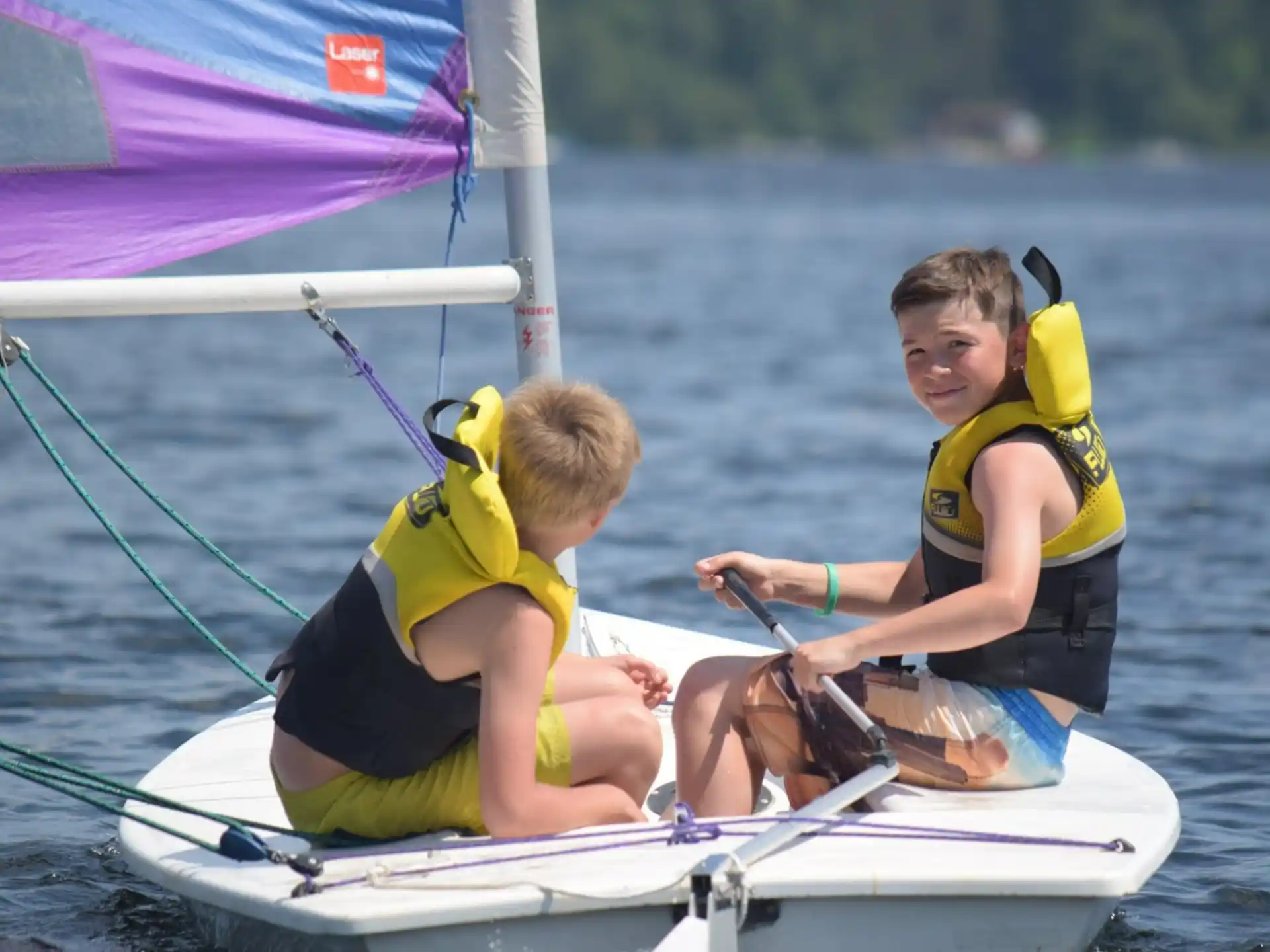 a couple of kids on a boat