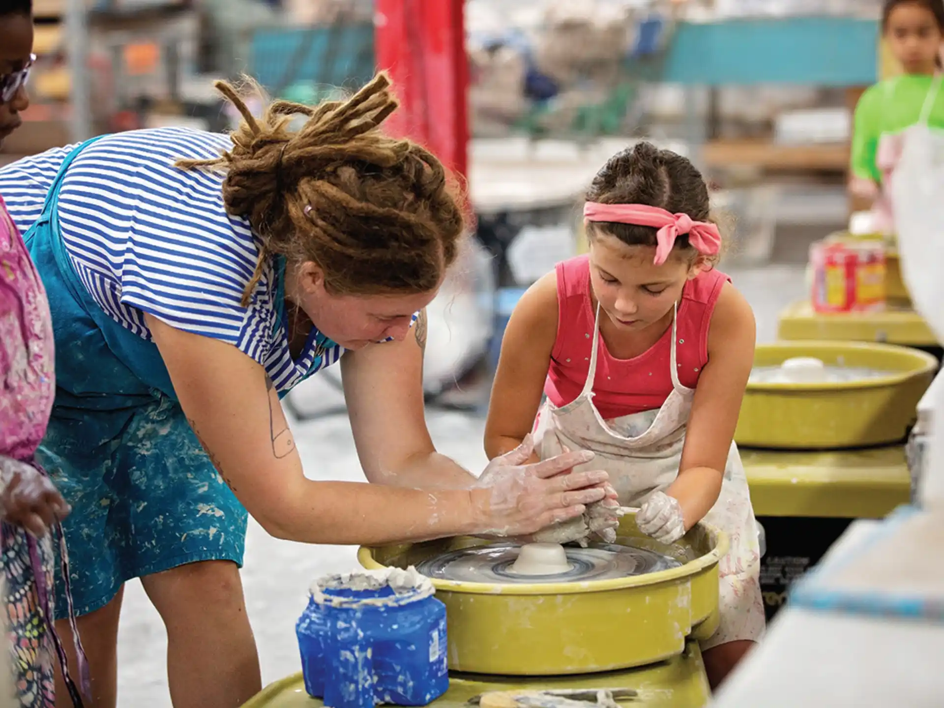 a person washing a child in a bucket