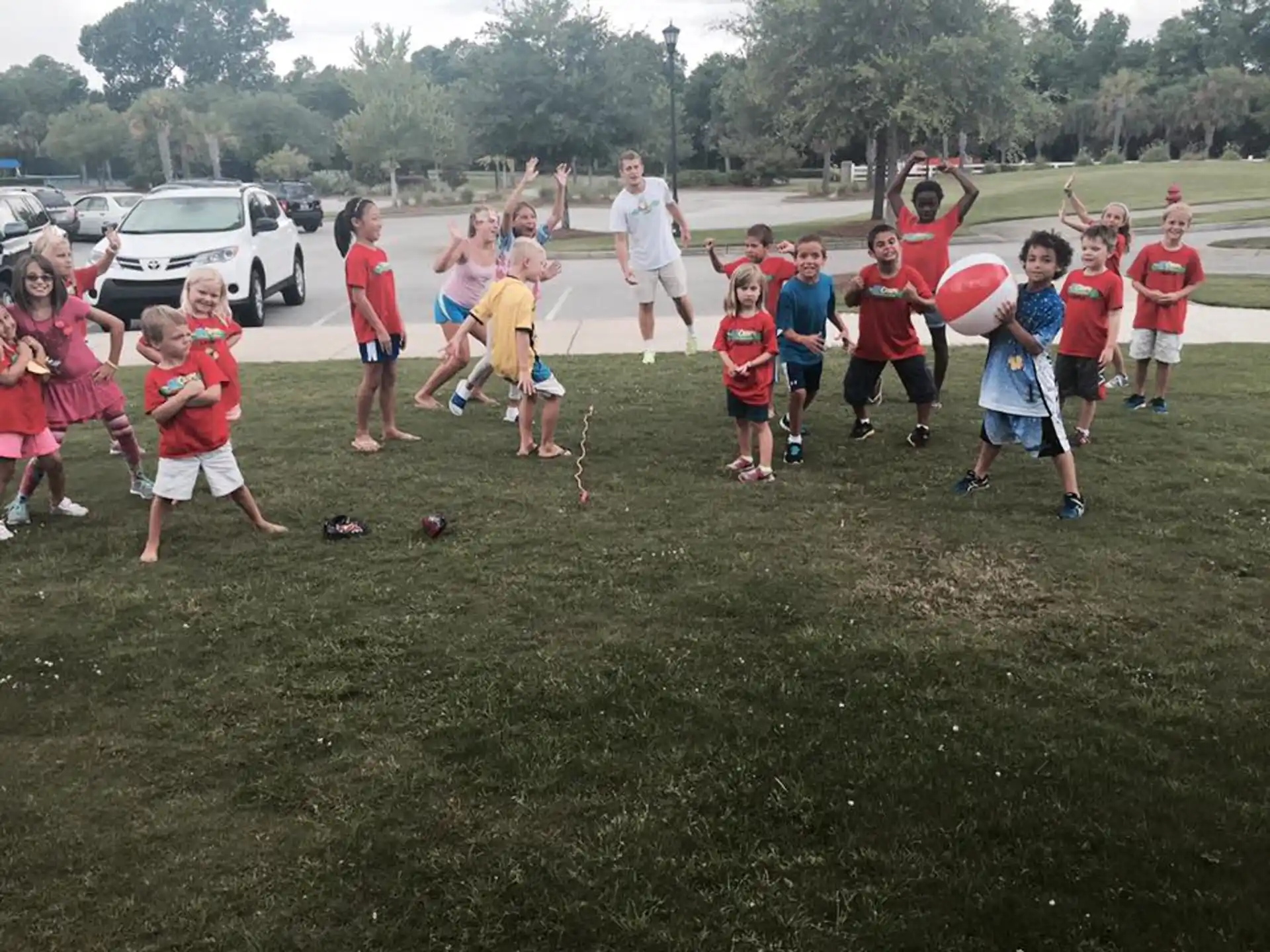 a group of kids playing with a ball