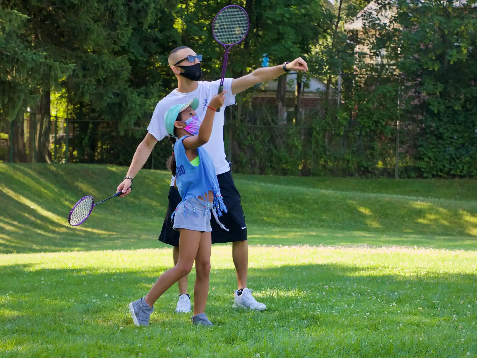 a couple of people play tennis