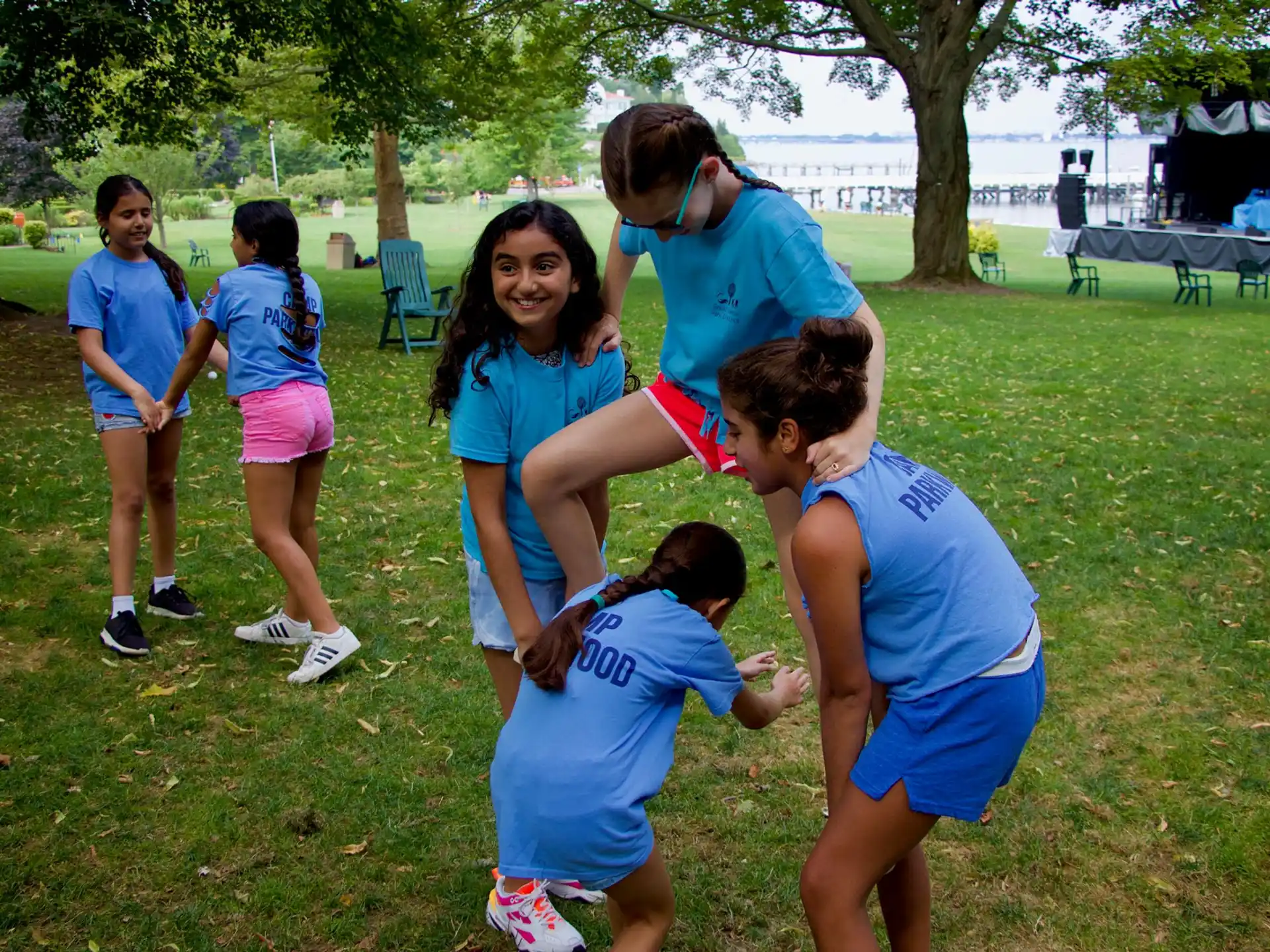 a group of people in blue shirts