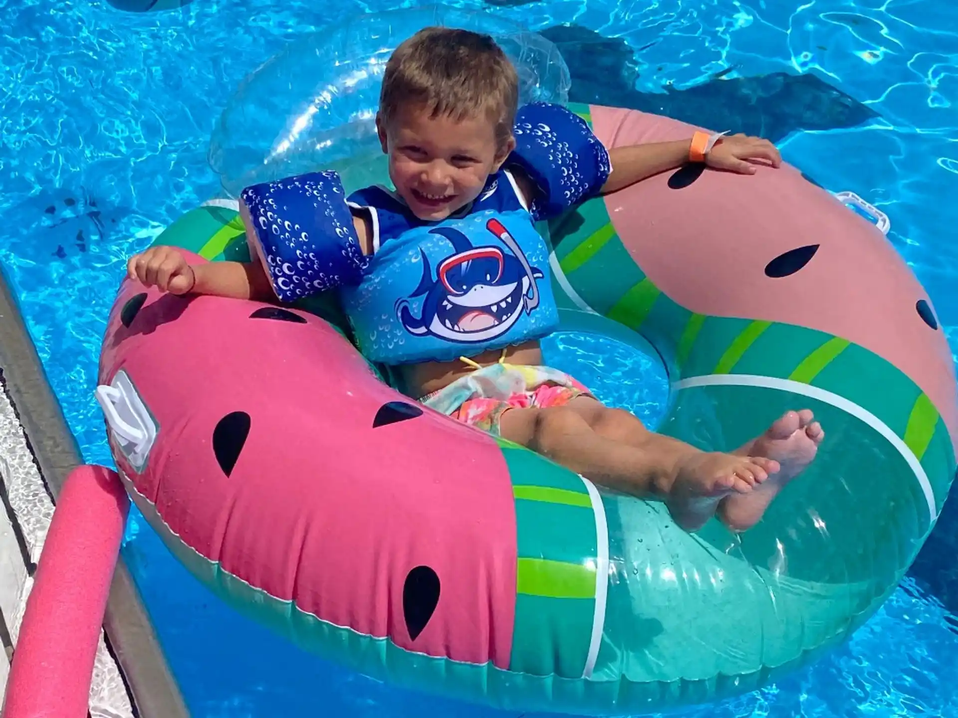 a boy in a pool