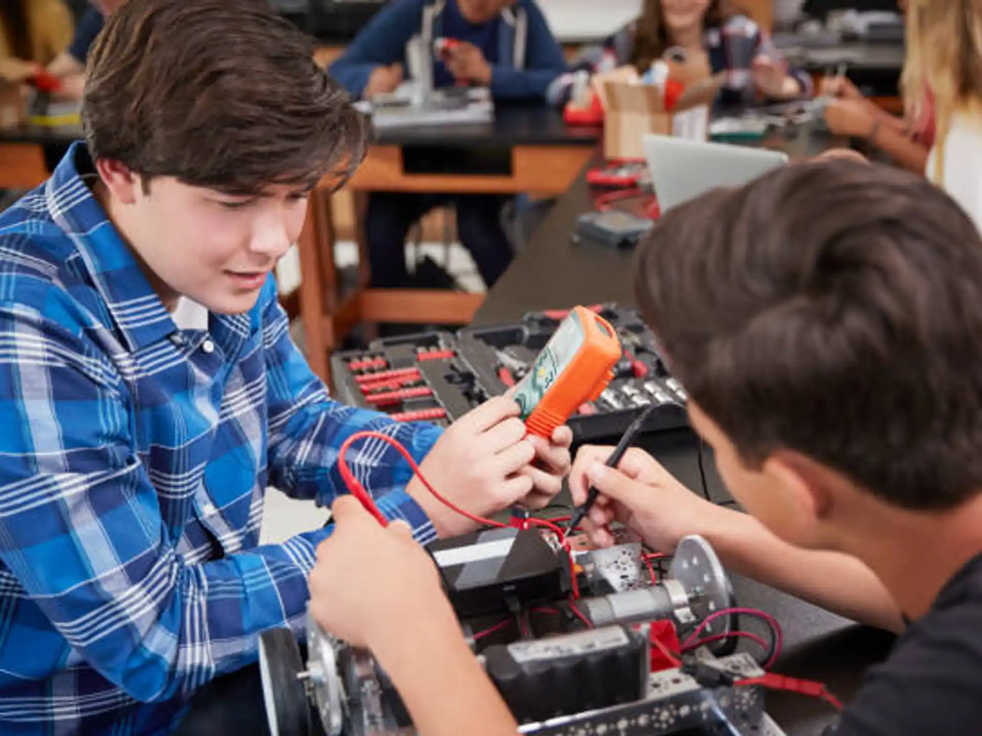 a few young men working on a computer