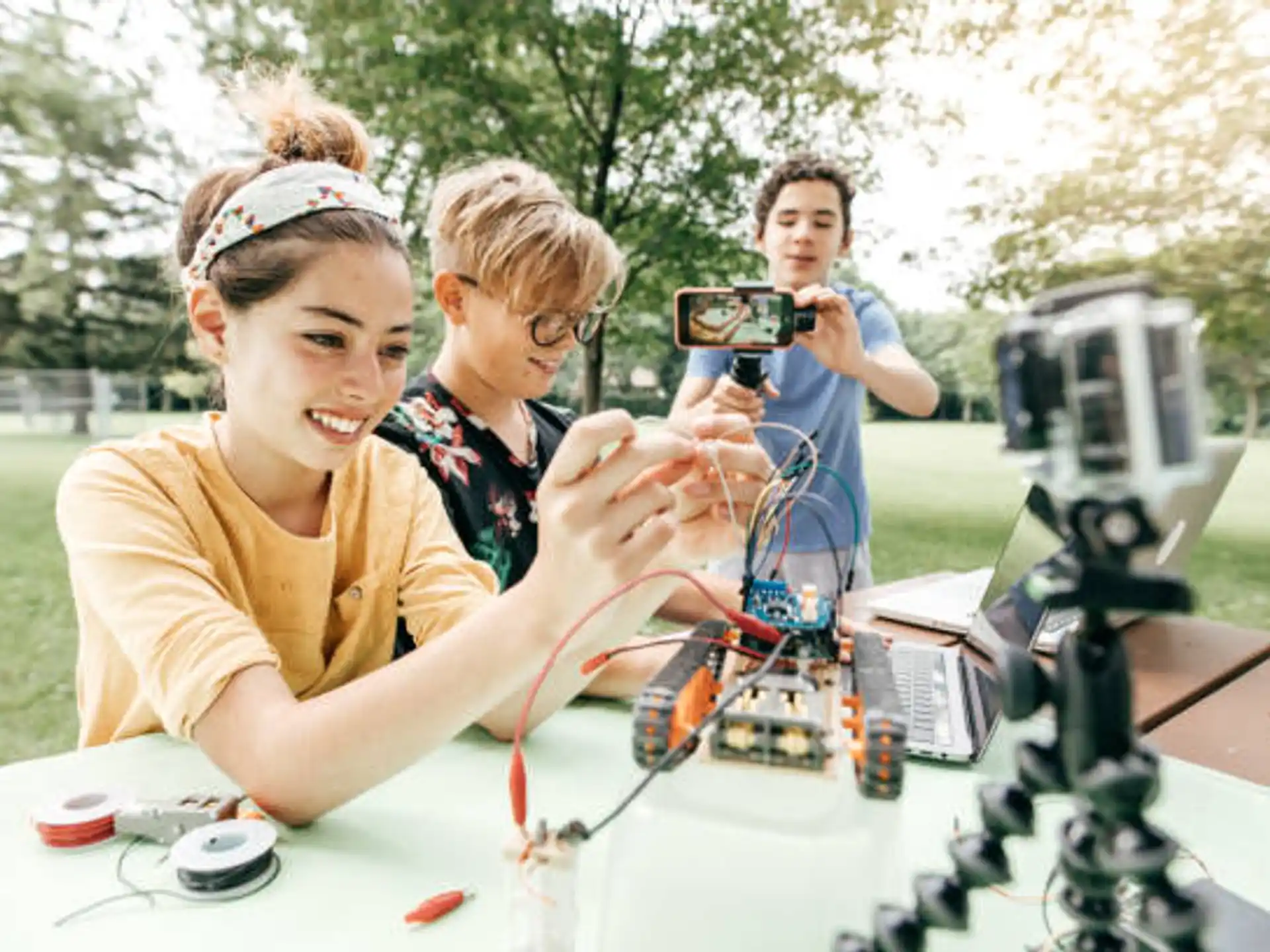 a group of people looking at a microscope