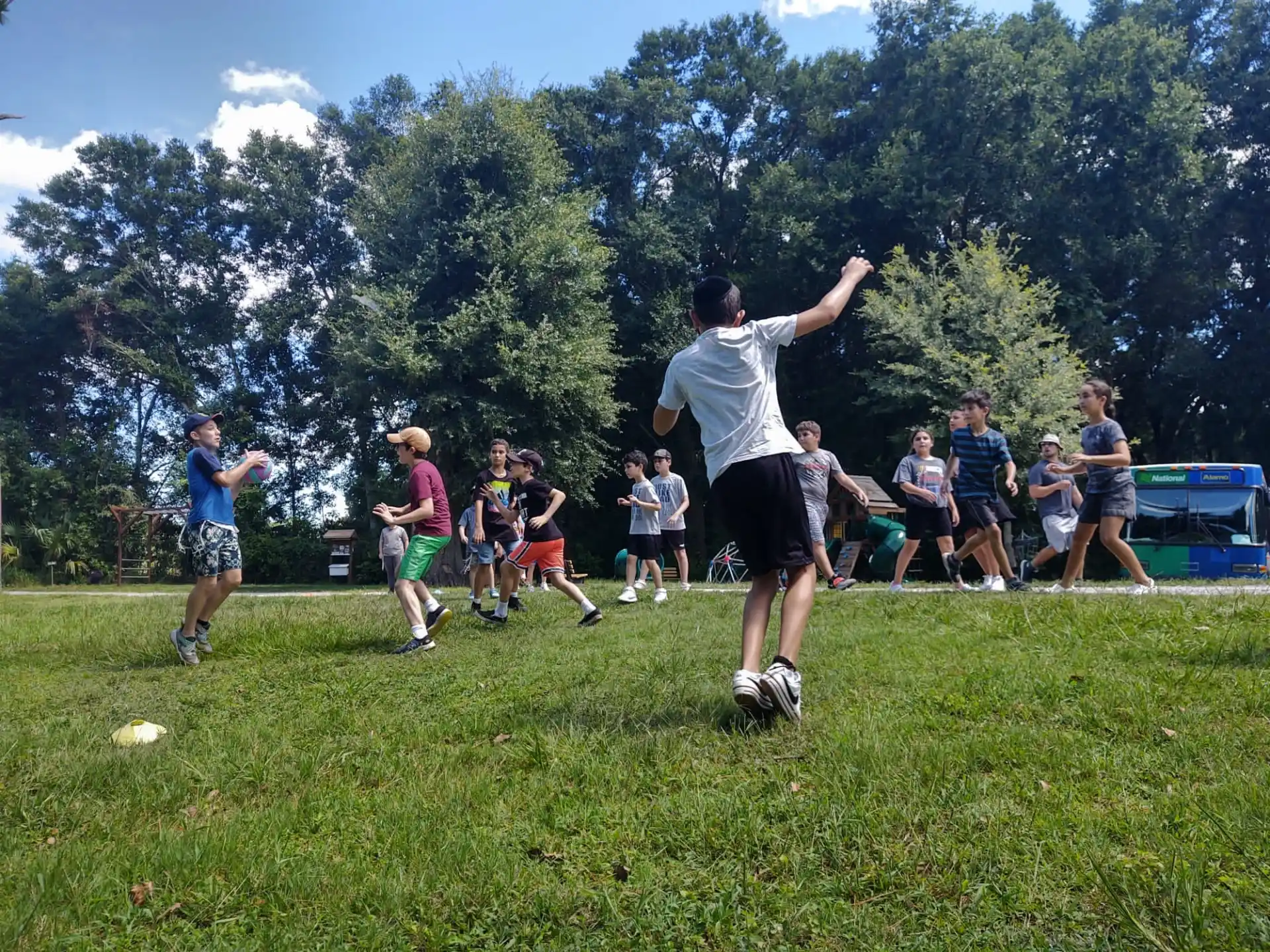 a group of people playing frisbee