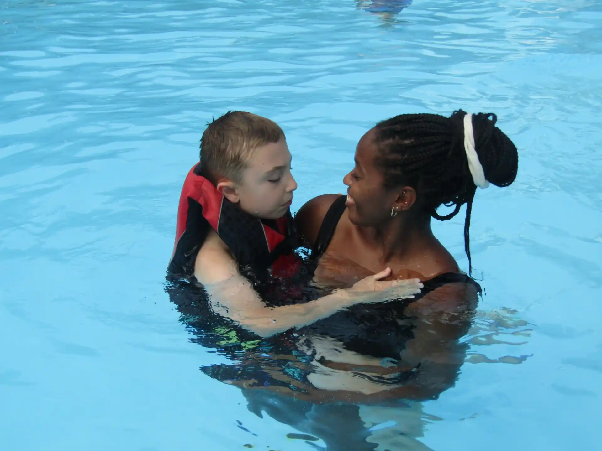 a boy and a dog in the water