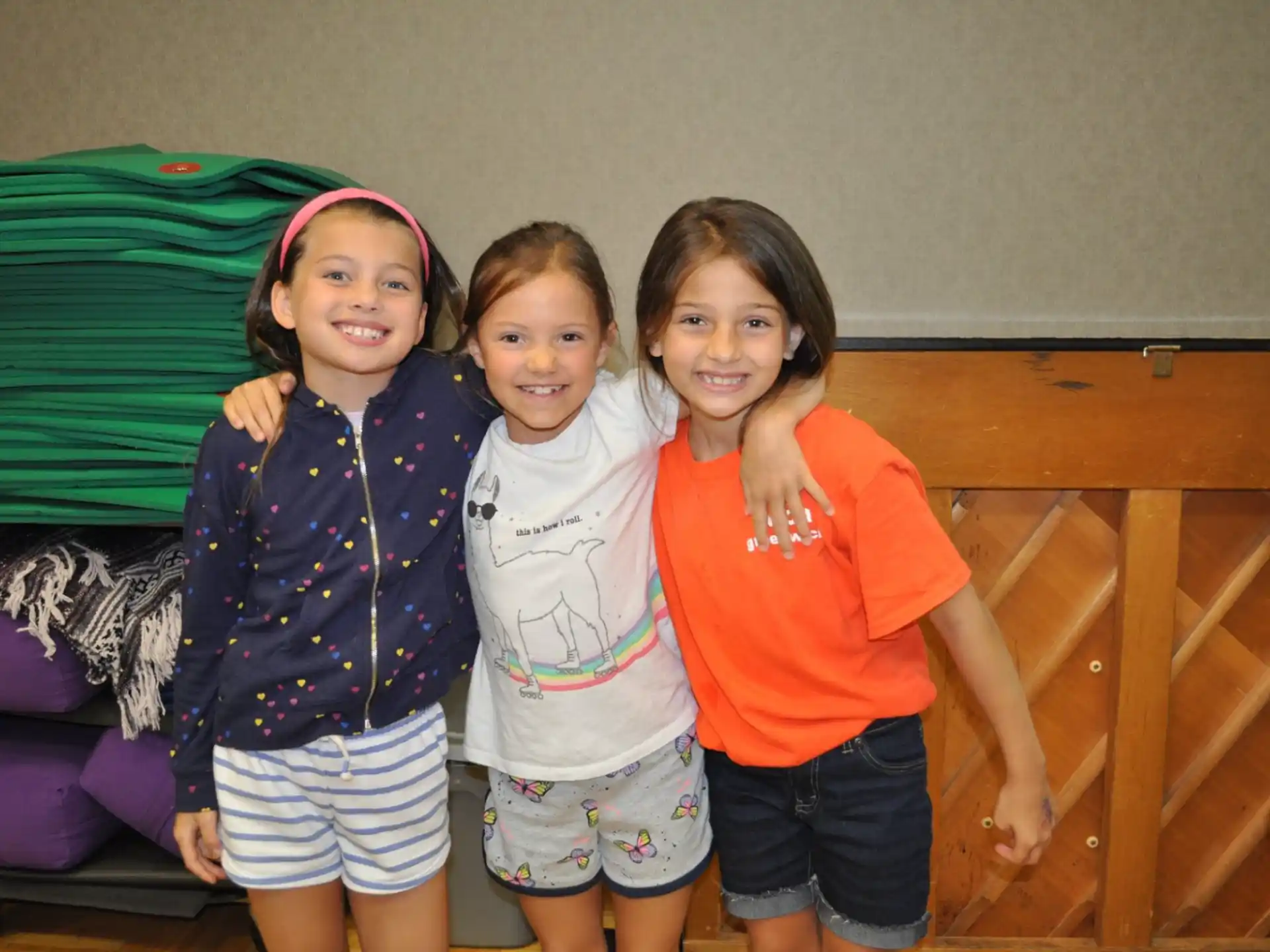 a group of girls posing for a photo