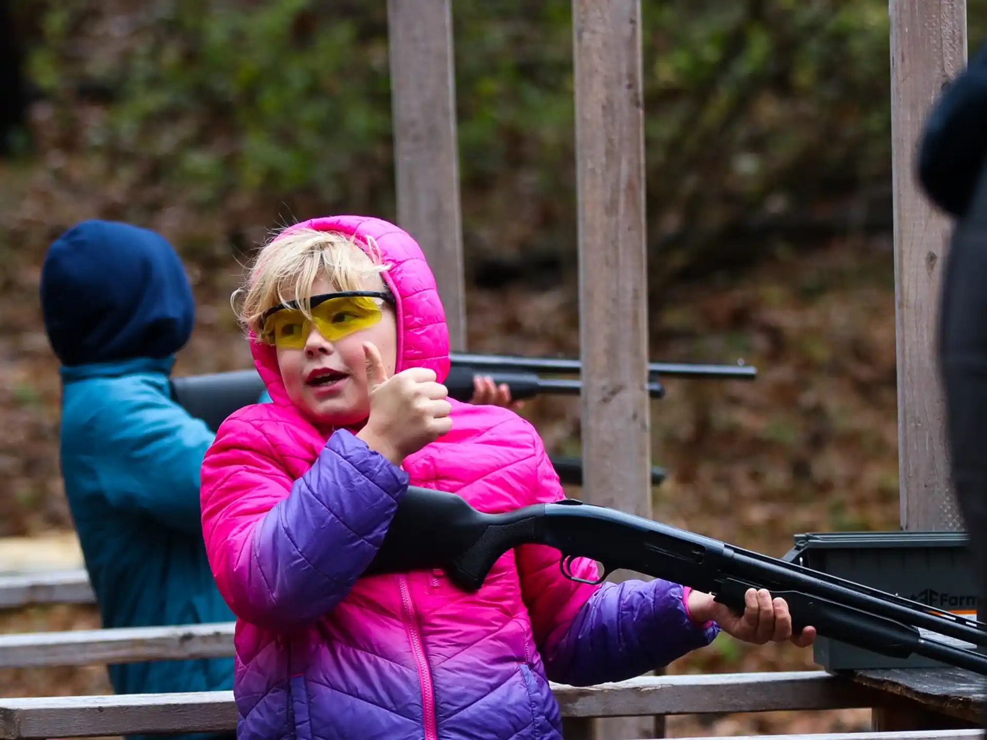a child holding a gun