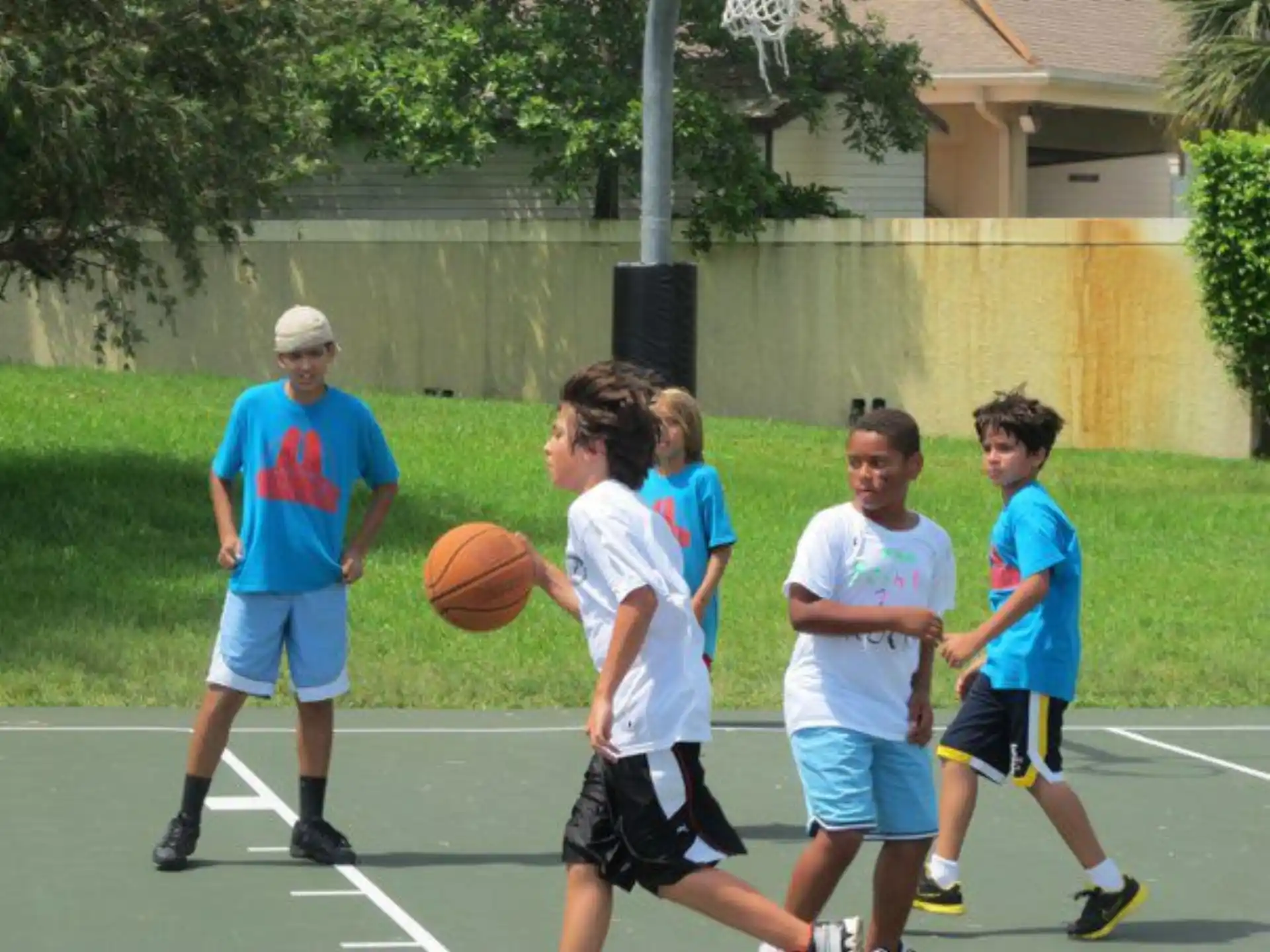 a group of boys playing basketball
