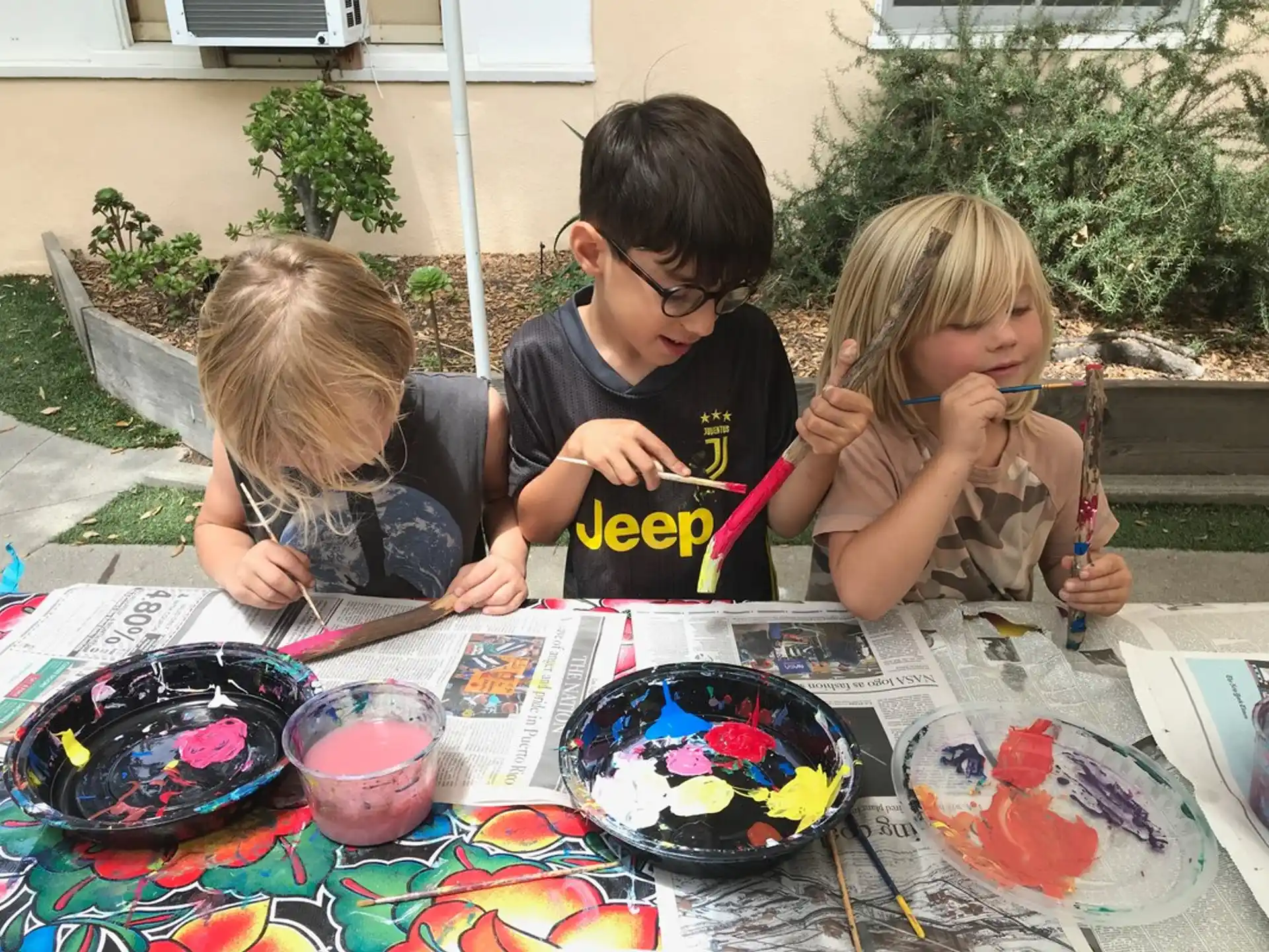 a group of children painting