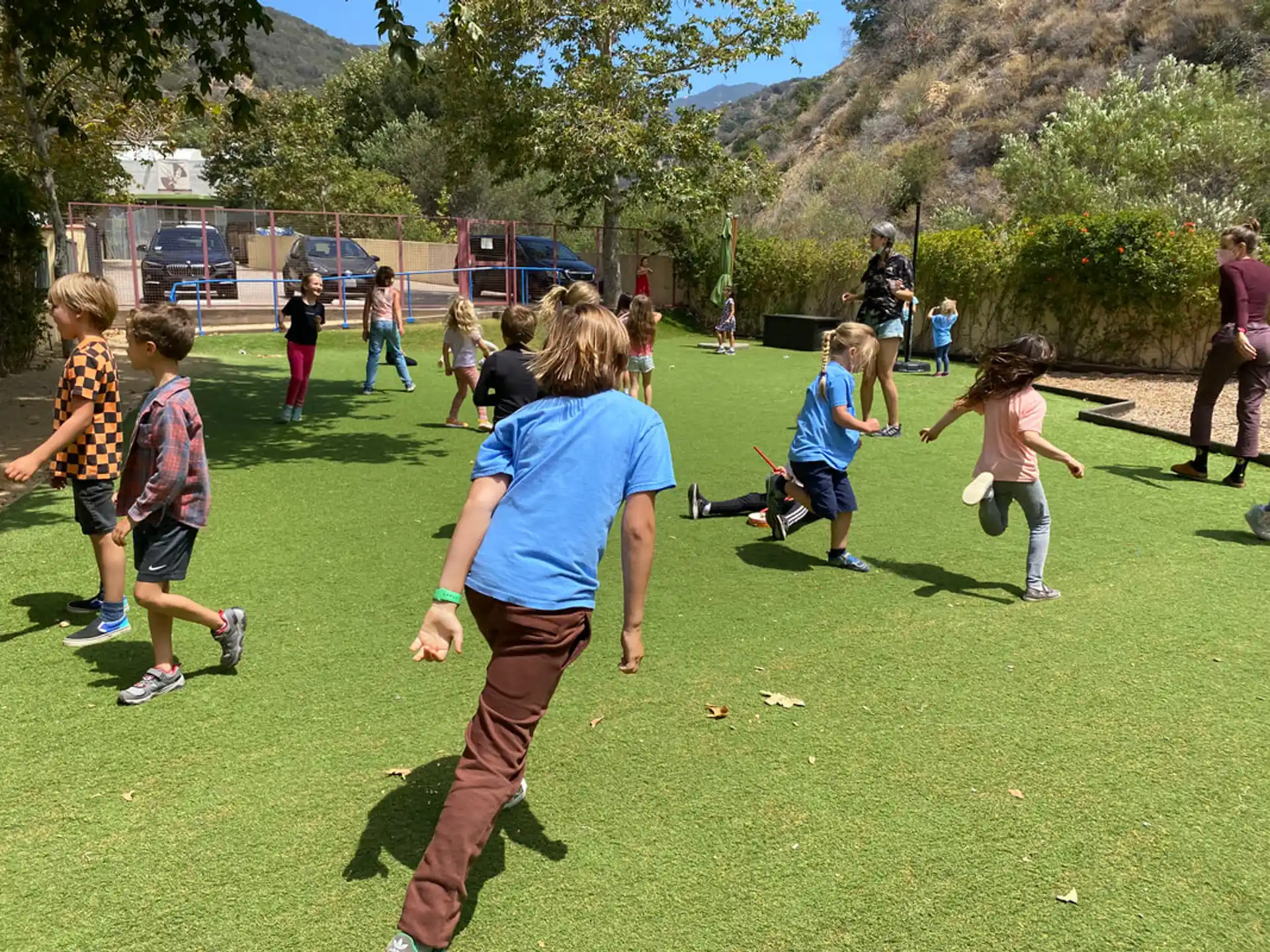 a group of people playing frisbee