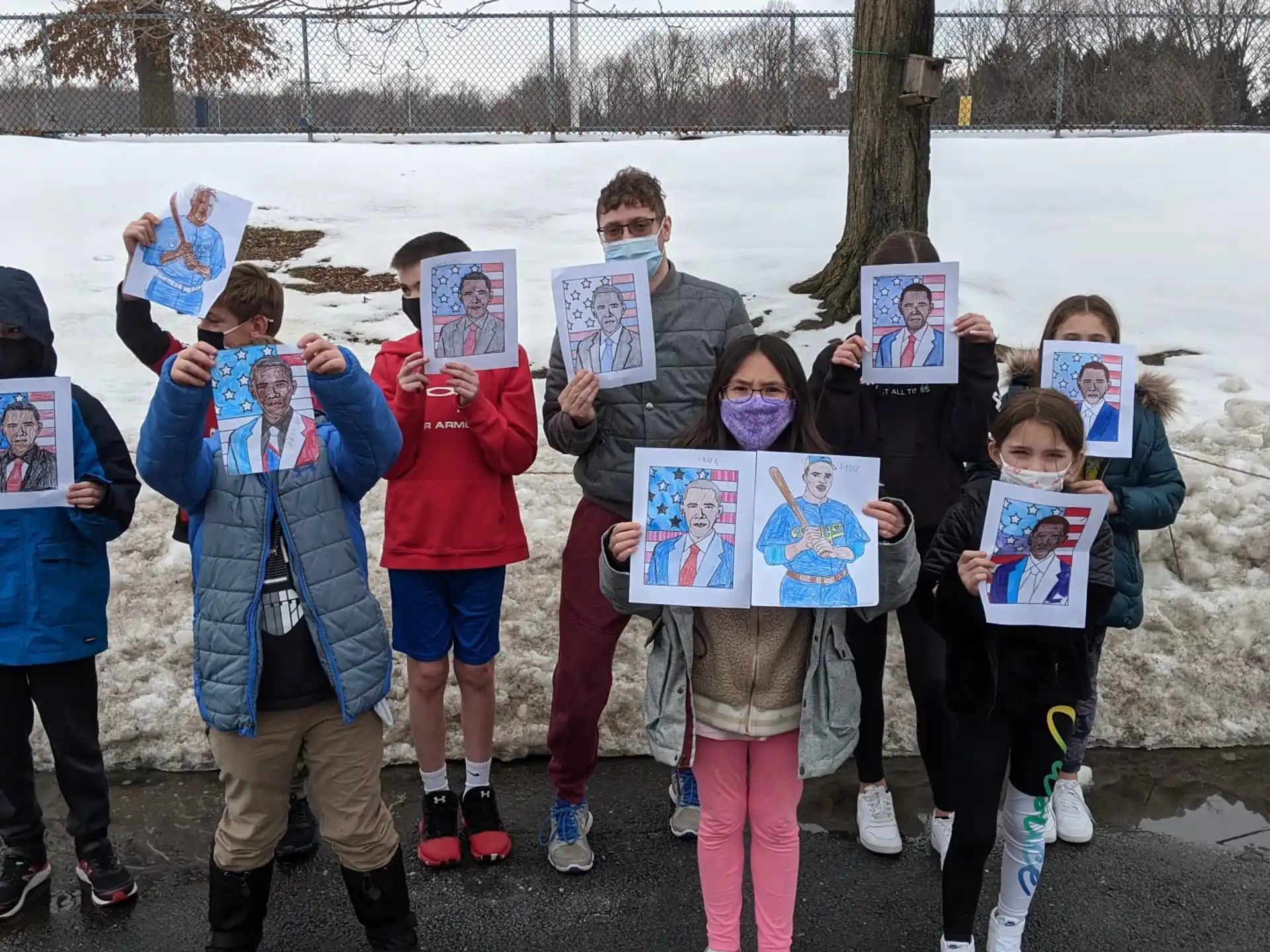 a group of children holding signs