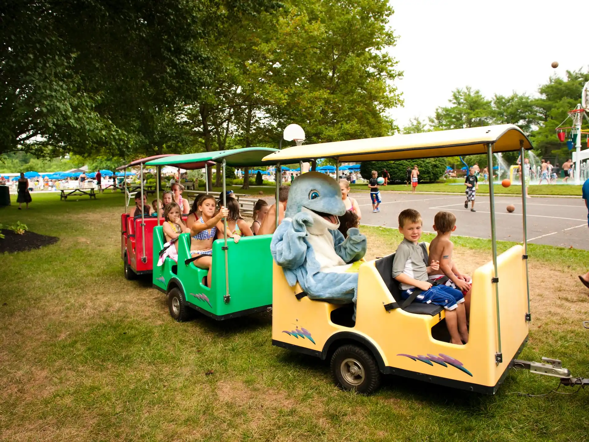 kids riding in a toy train
