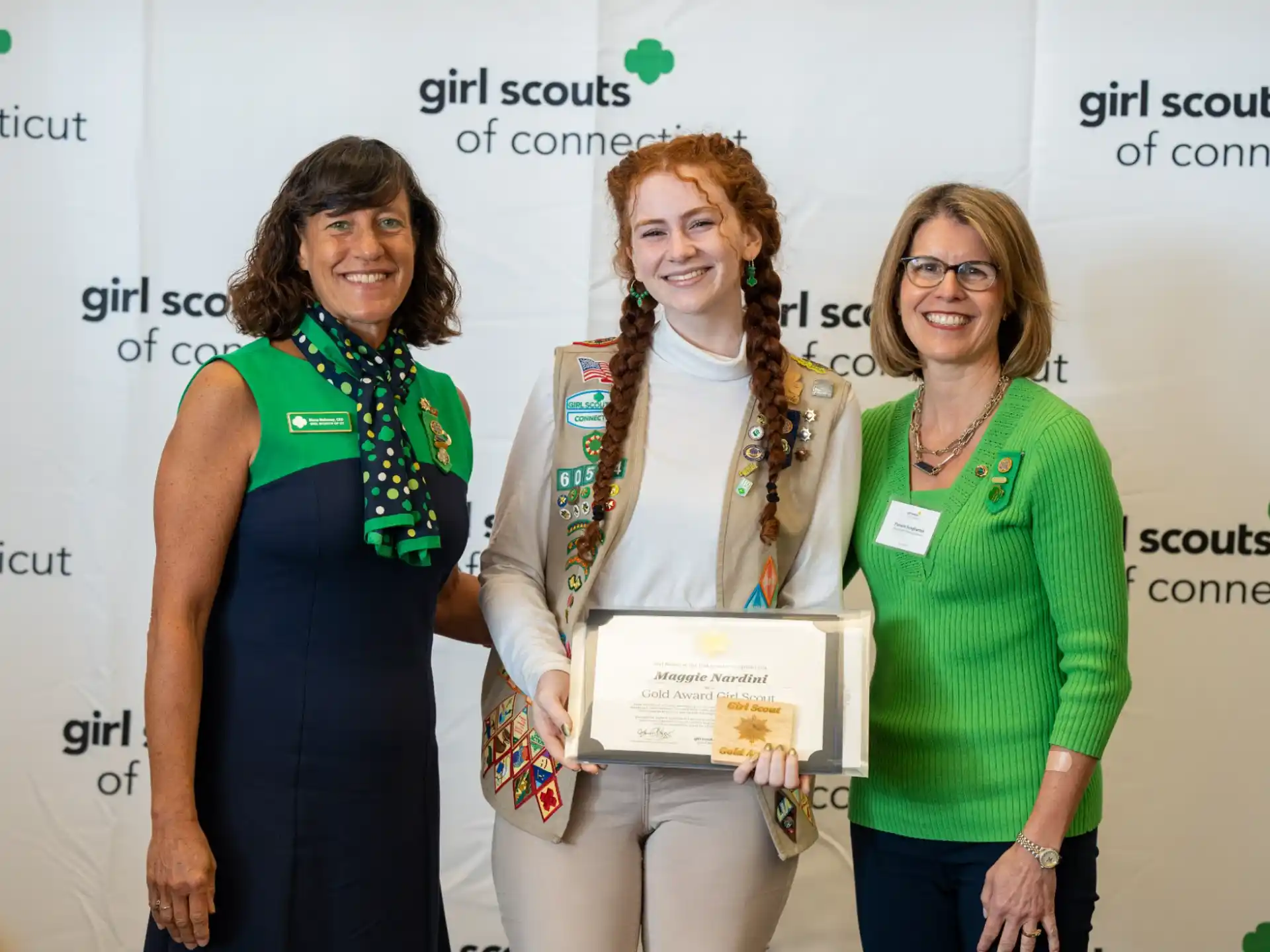 a group of women holding a certificate