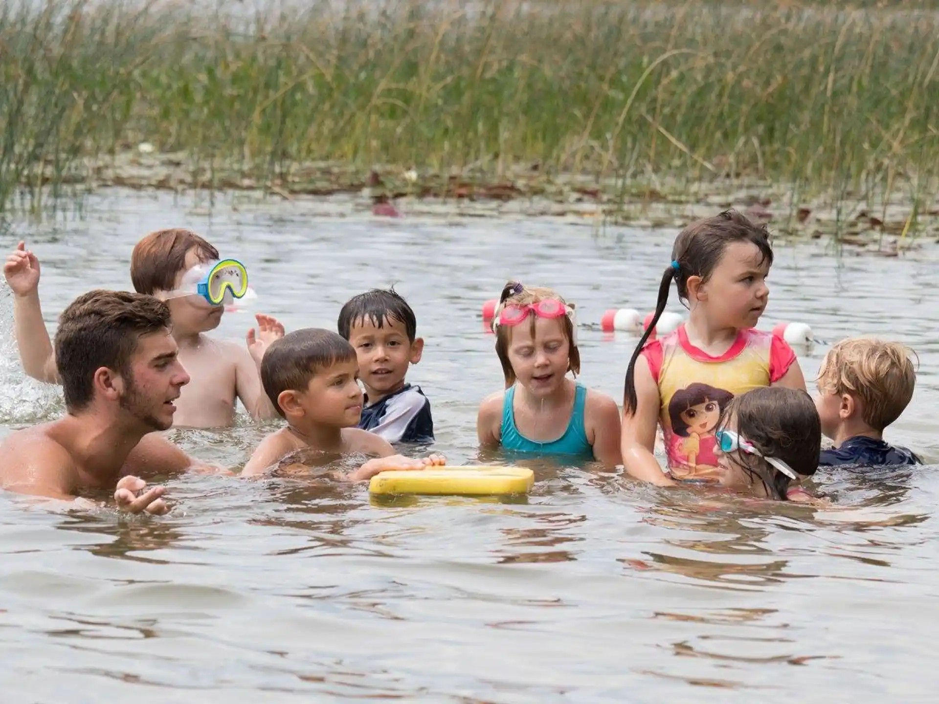 a group of people in a body of water