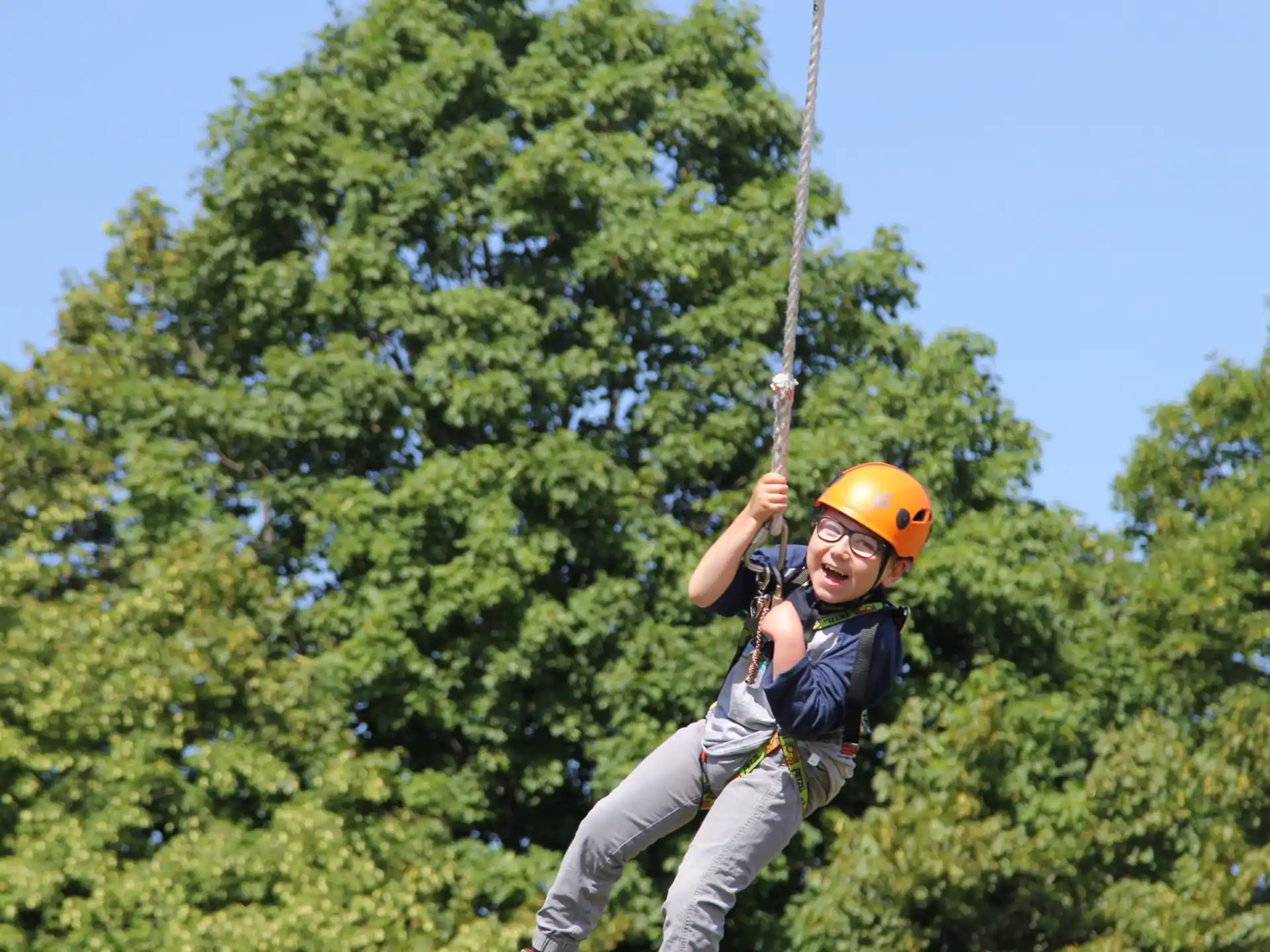 a boy on a zip line
