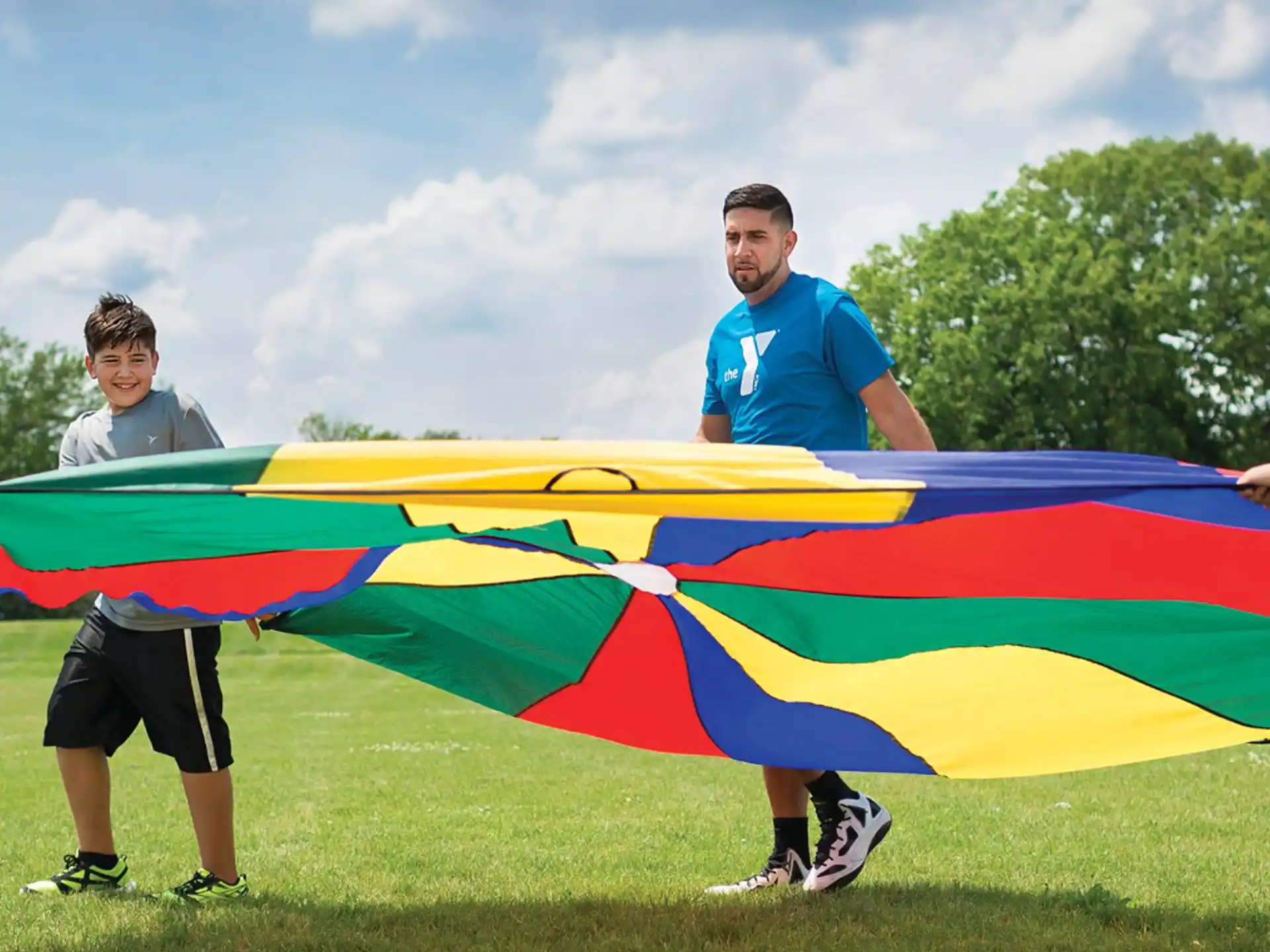a group of people holding a rainbow flag