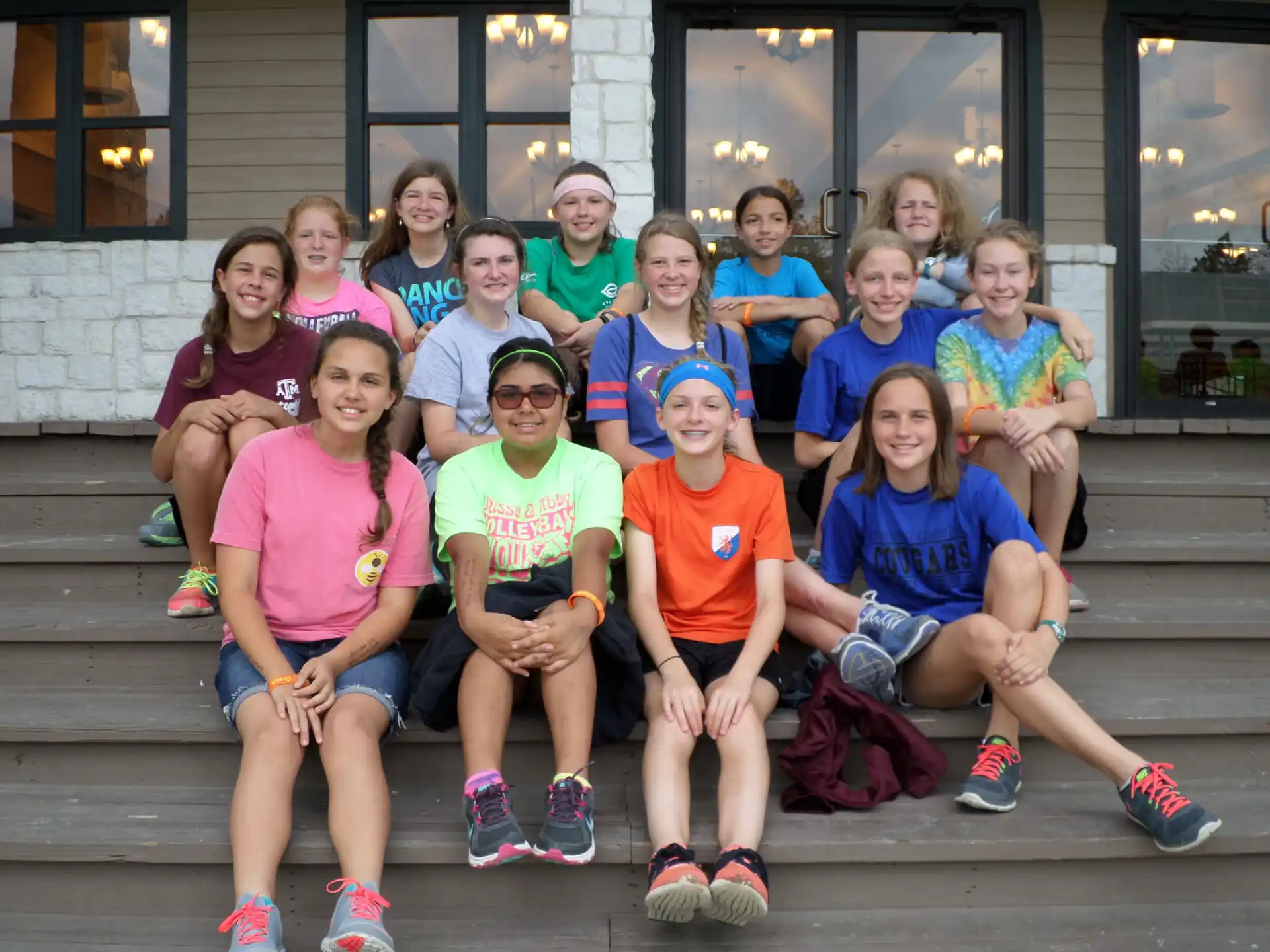 a group of people sitting on a bench