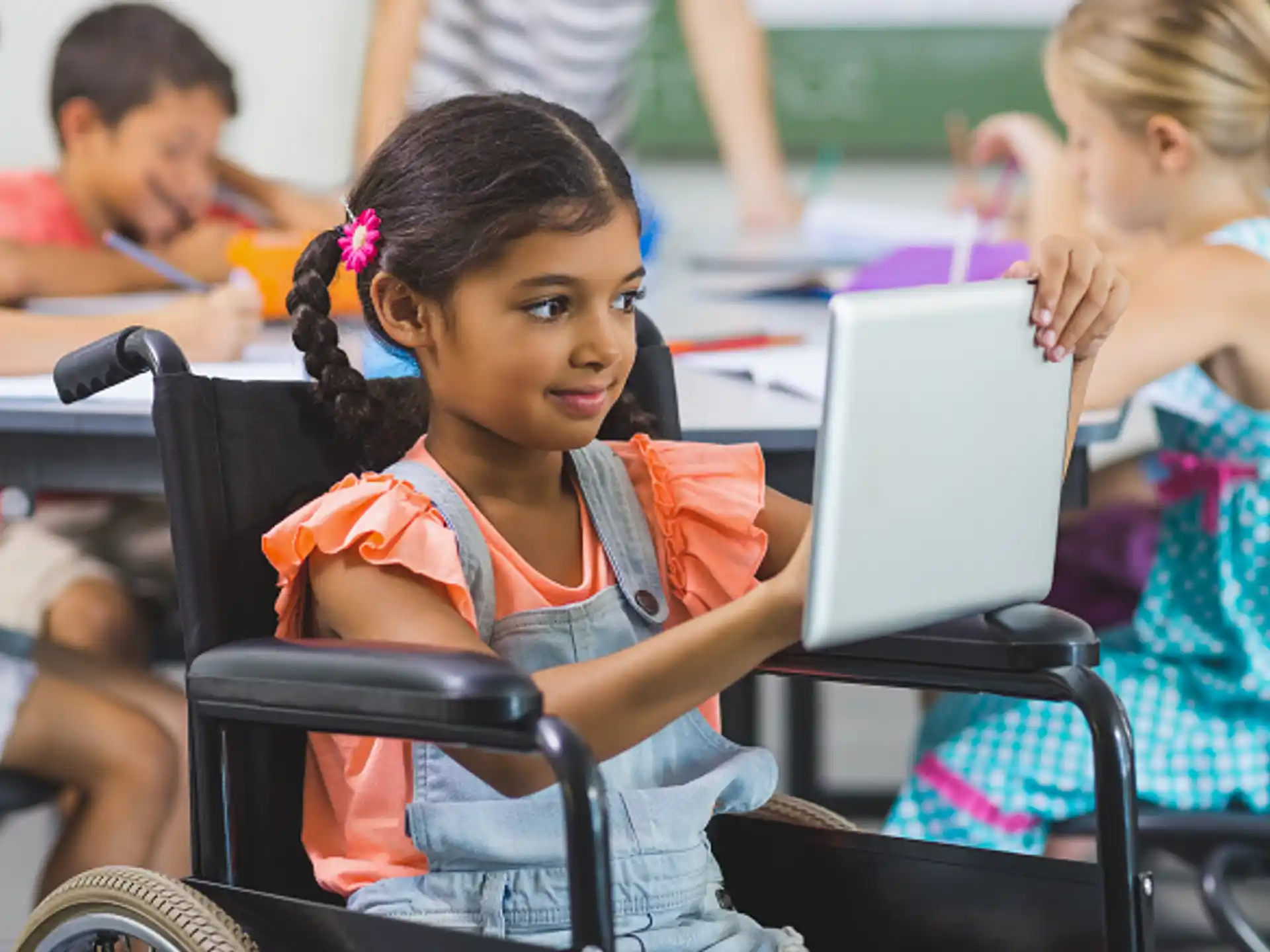 a young girl using a laptop