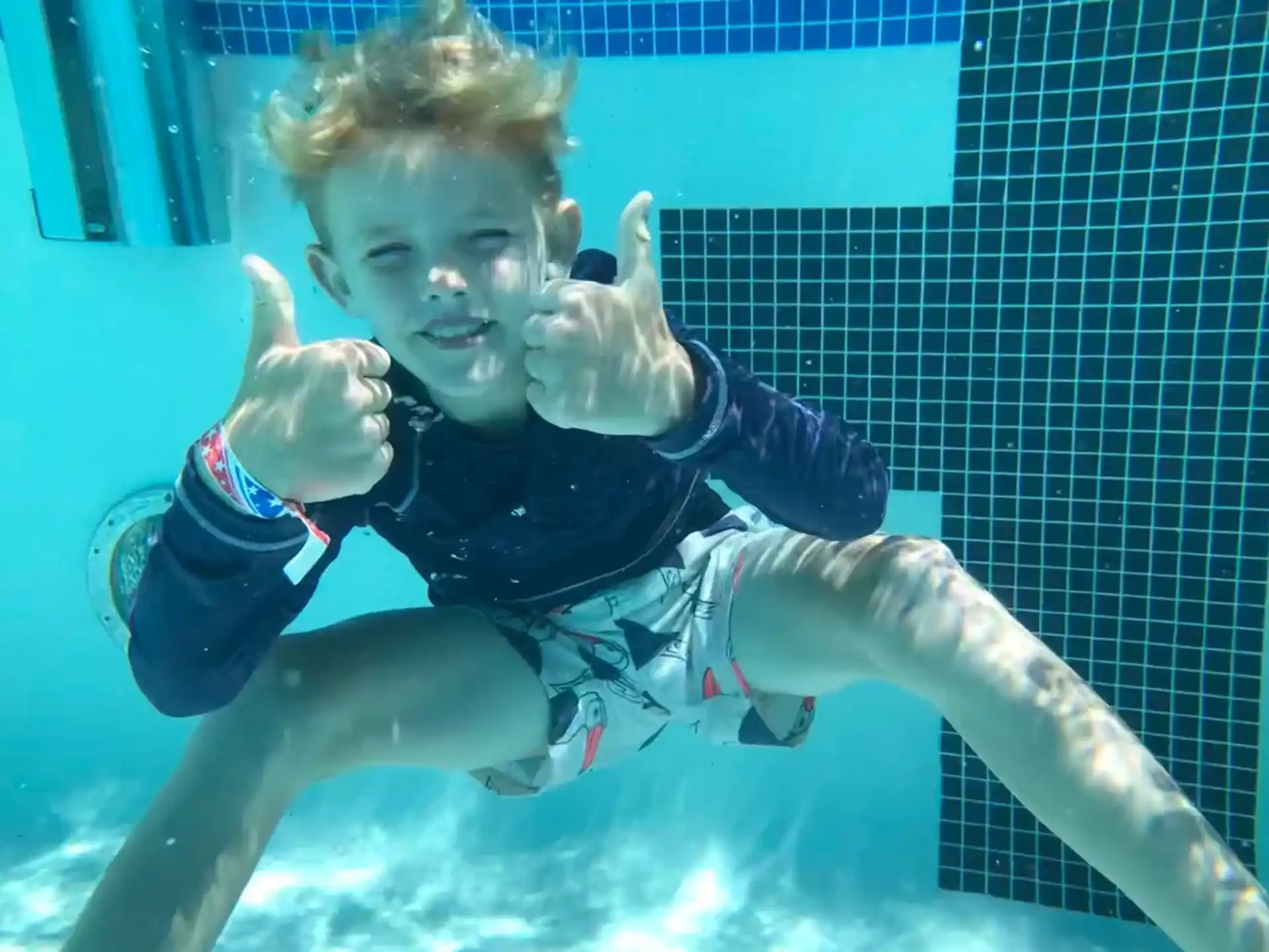 a boy in a pool