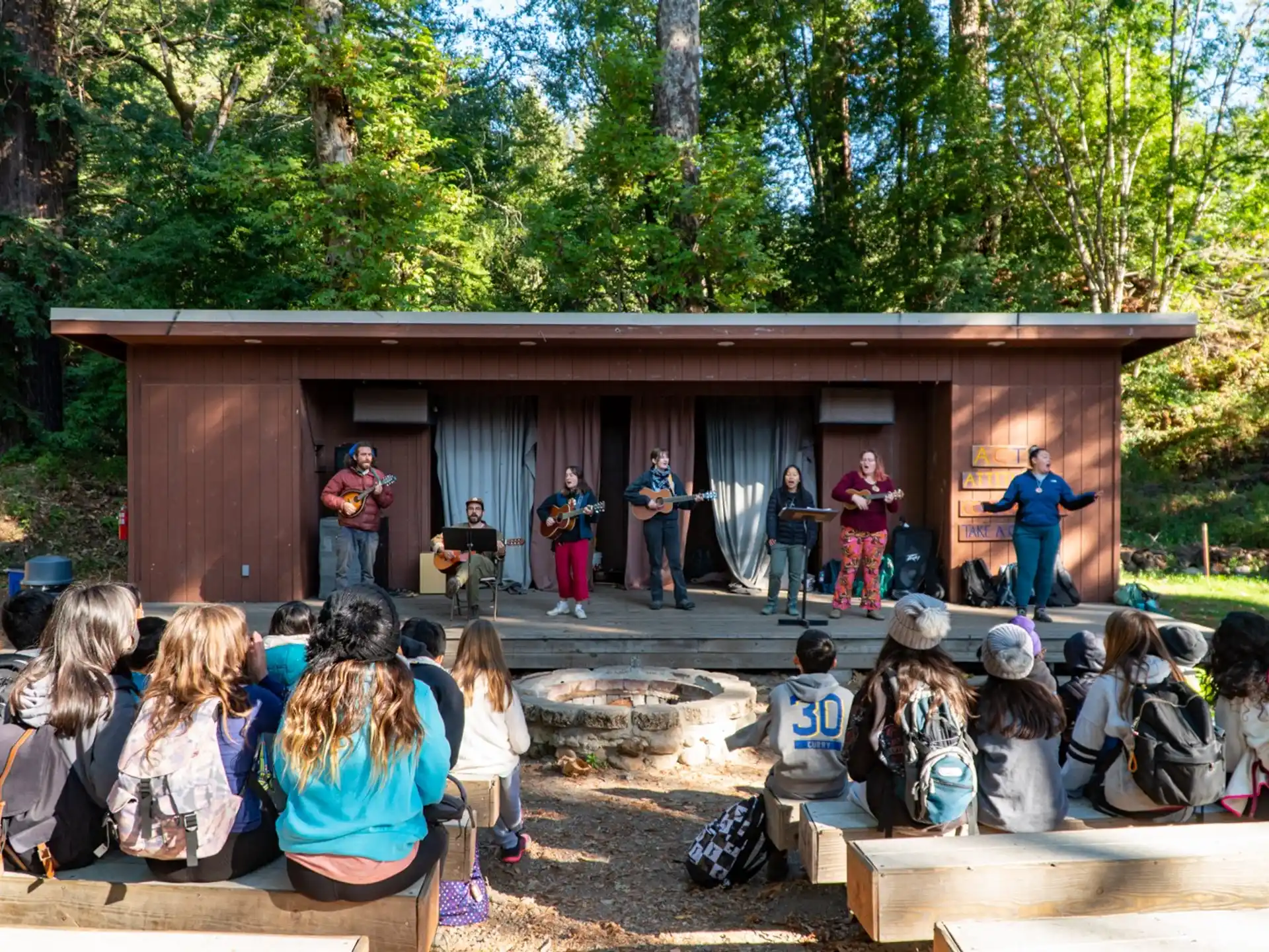 a group of people performing on stage