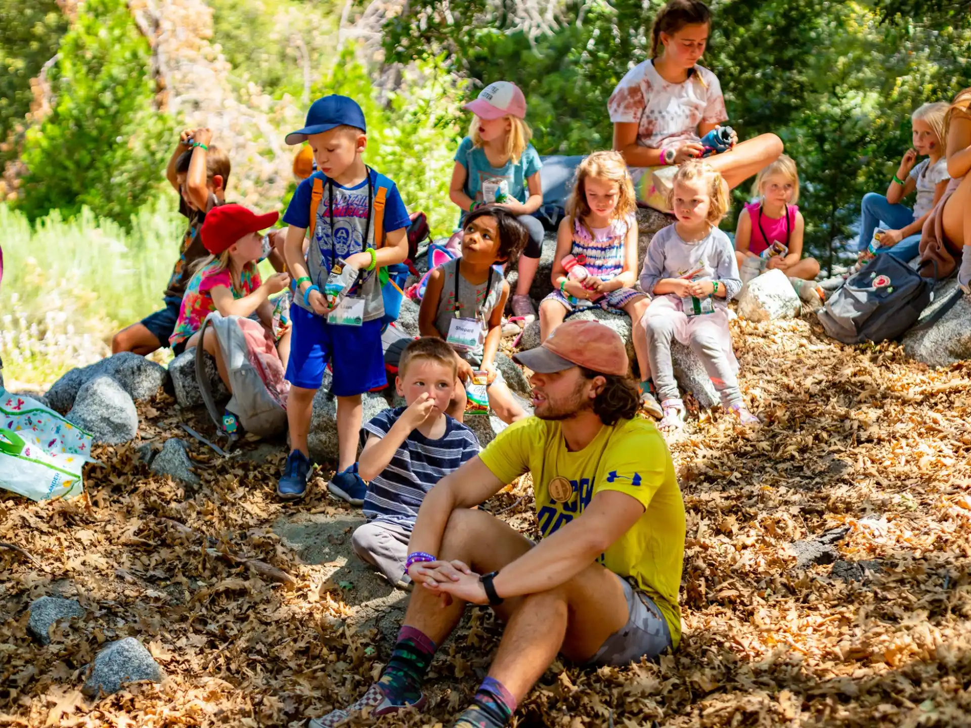 a group of people sitting on the ground