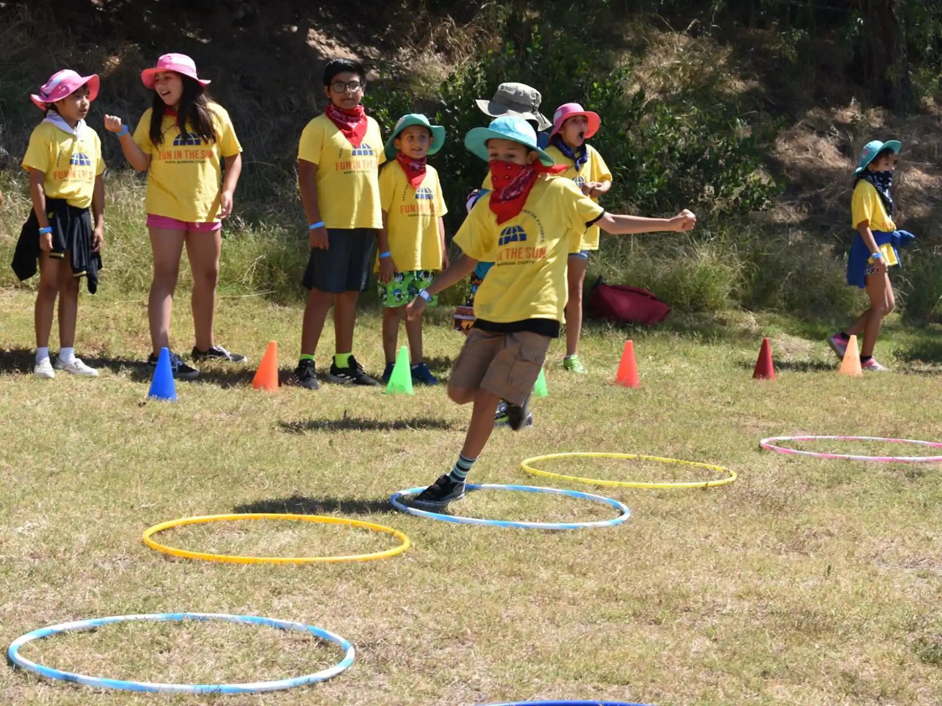 a group of people playing in a field