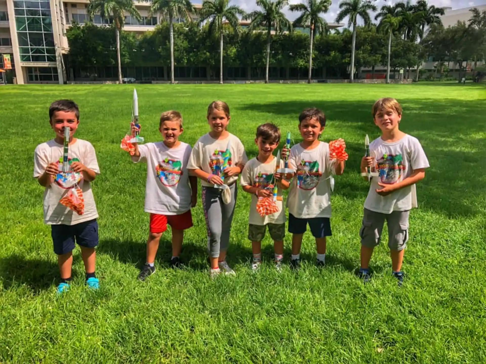 a group of boys holding trophies