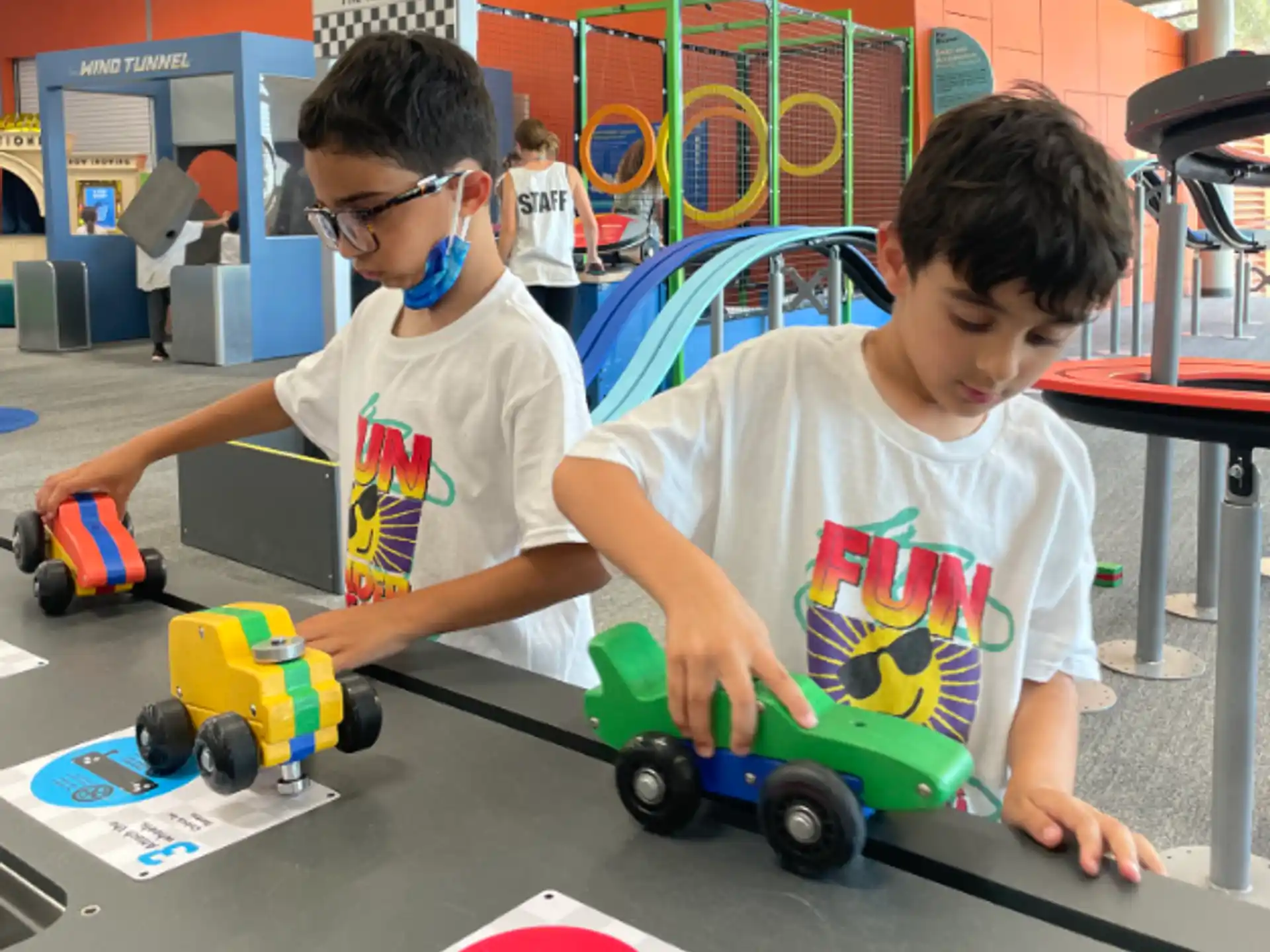 a couple of boys playing with toys