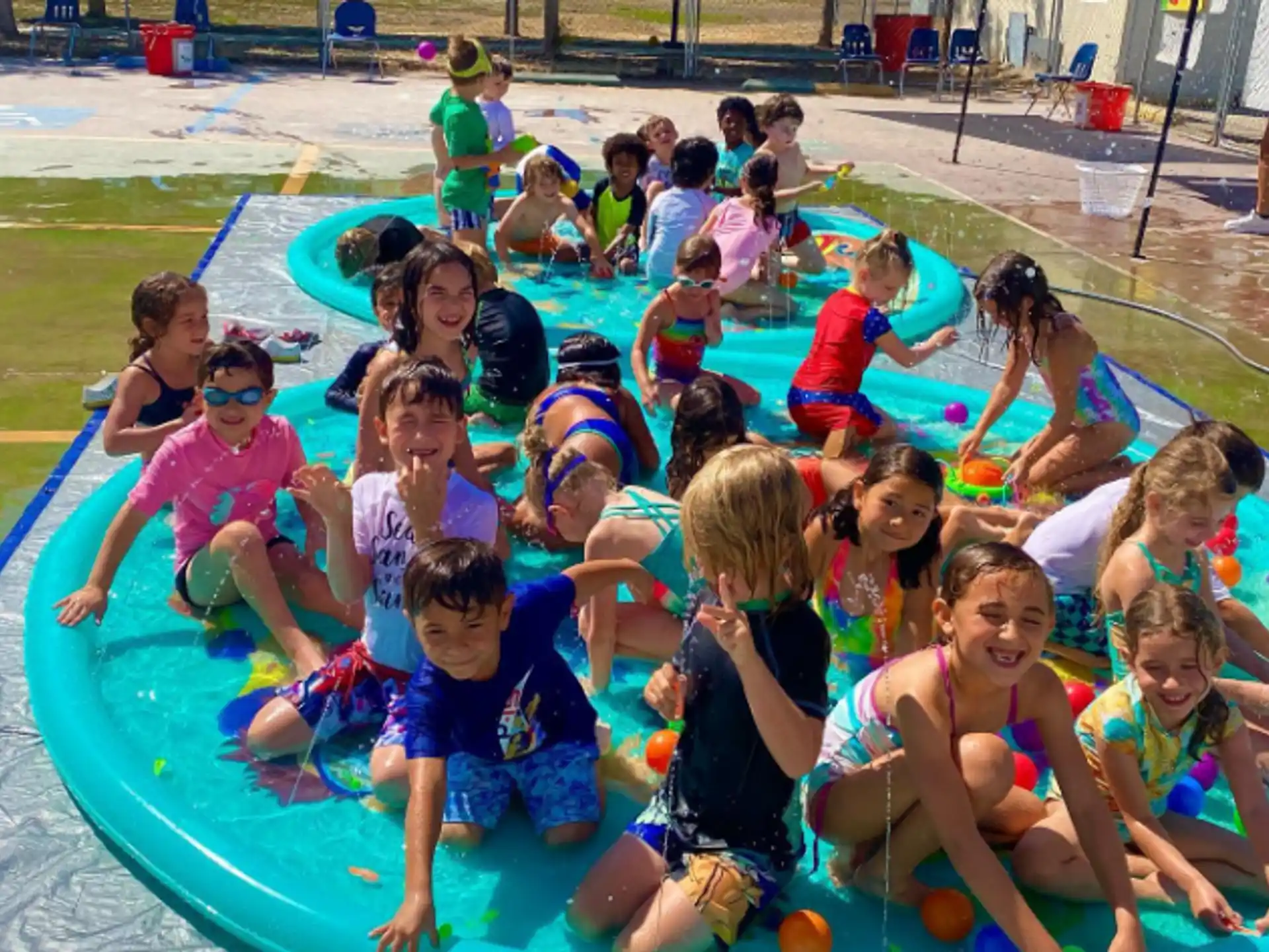 a group of children in a pool