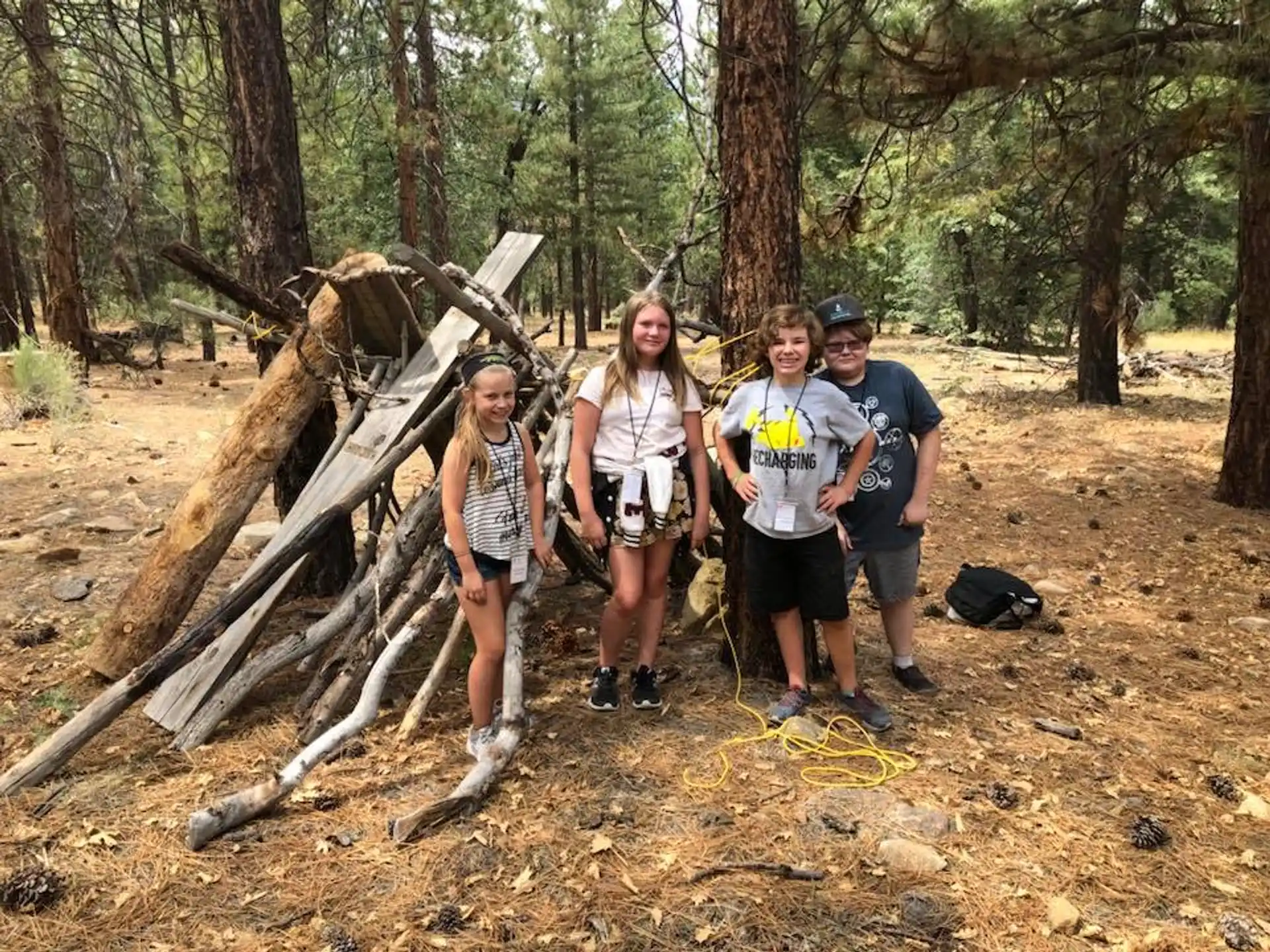 a group of people standing in the woods