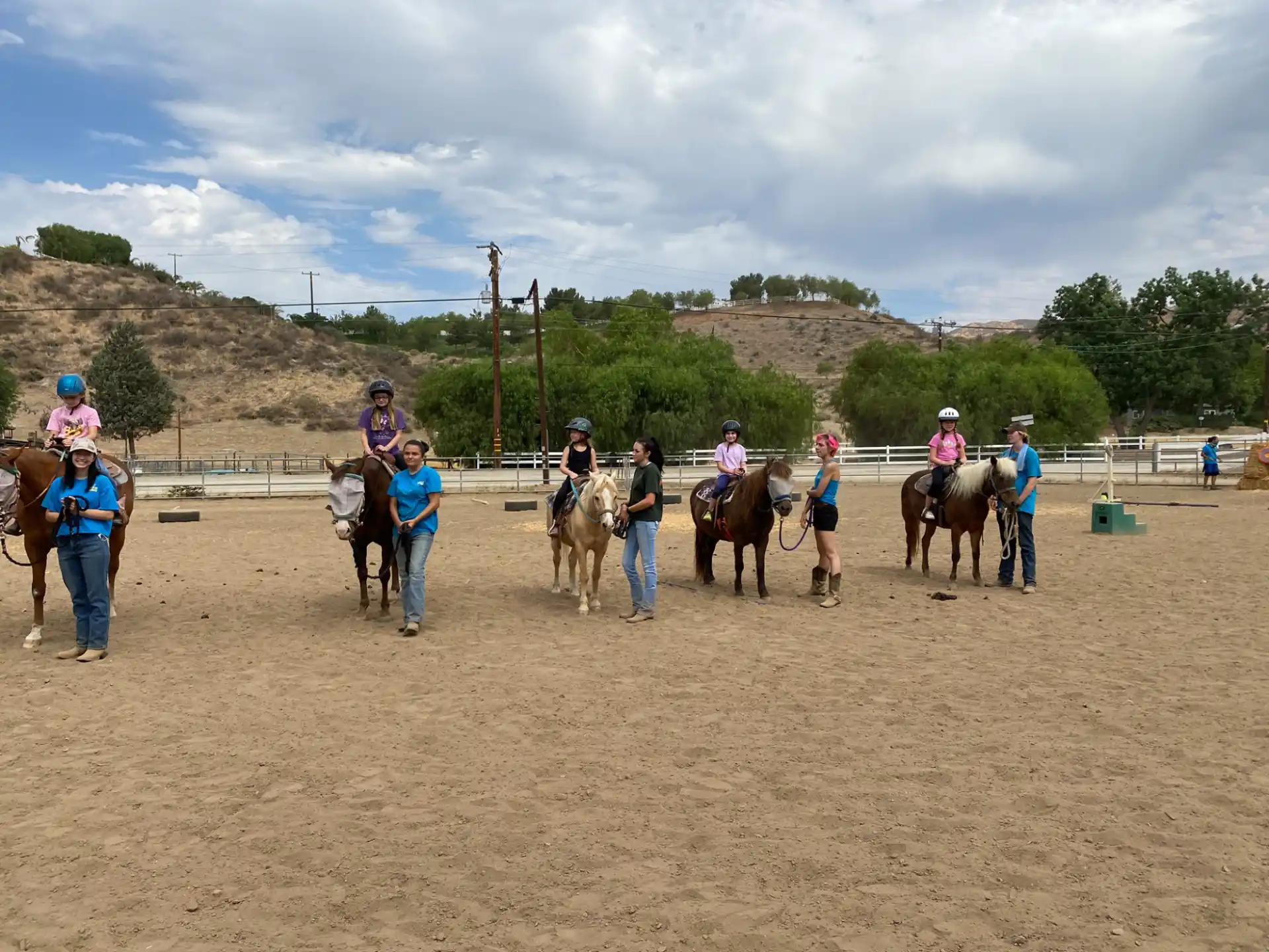 a group of people riding horses
