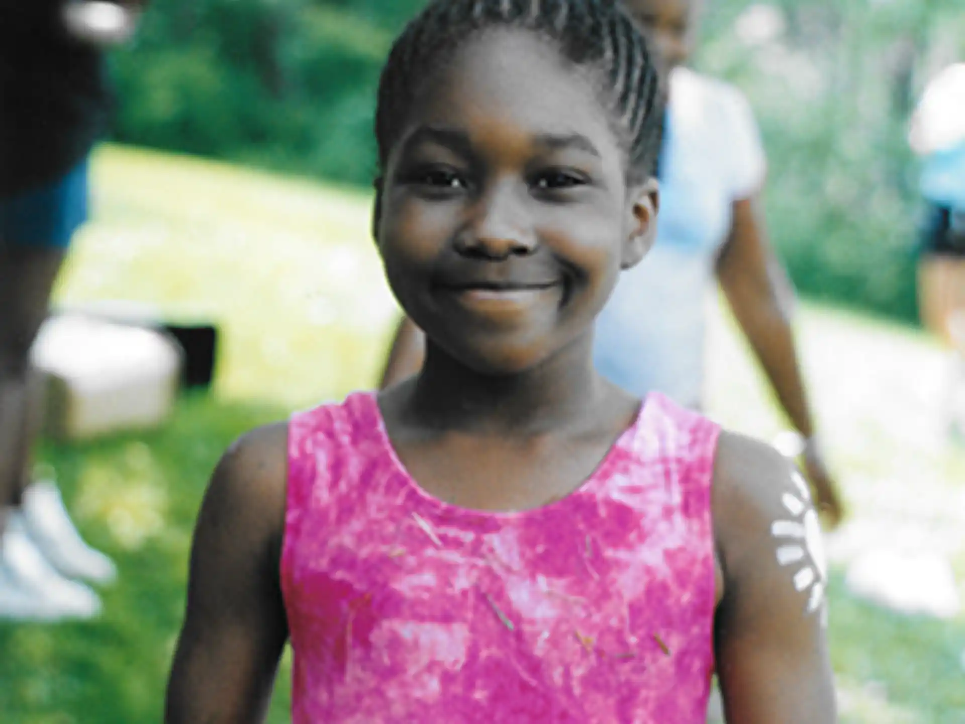 a young girl smiling