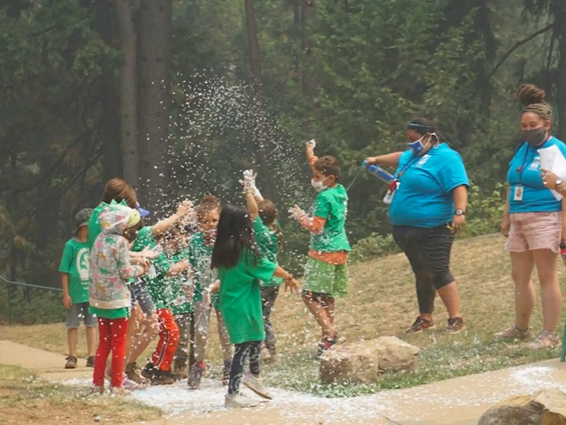 a group of people playing in the water