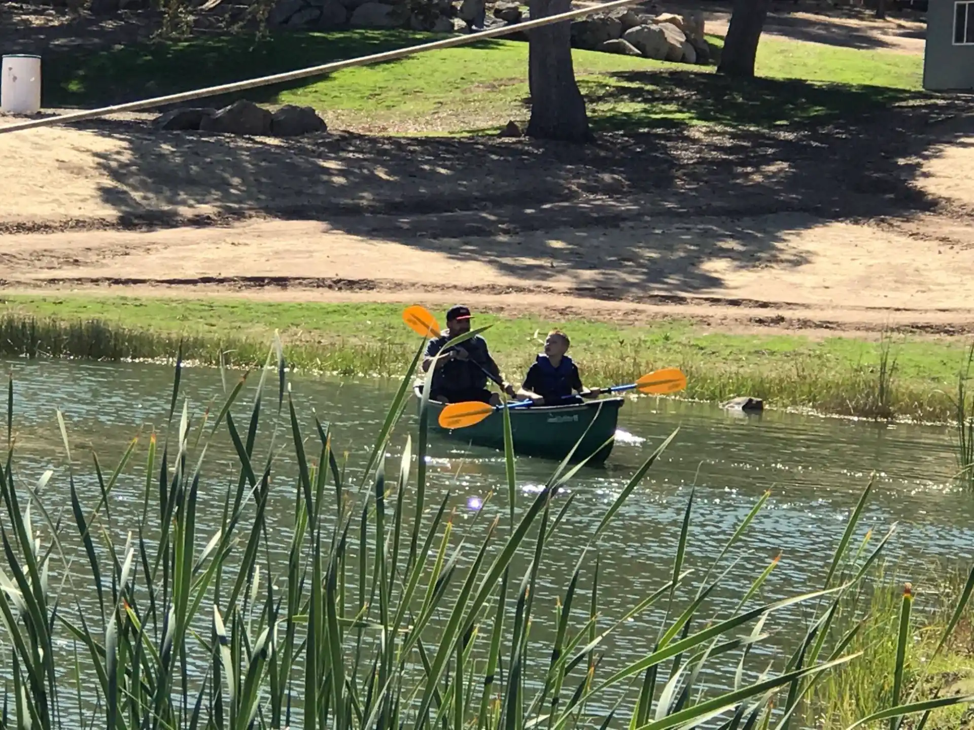 two people in a canoe on a river