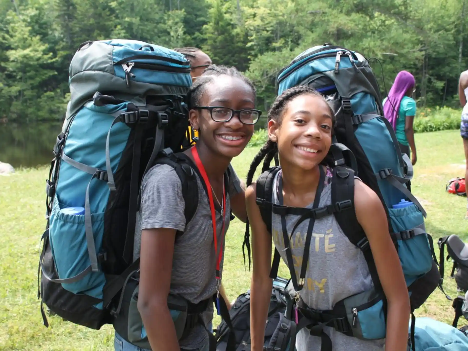 a man and woman with backpacks