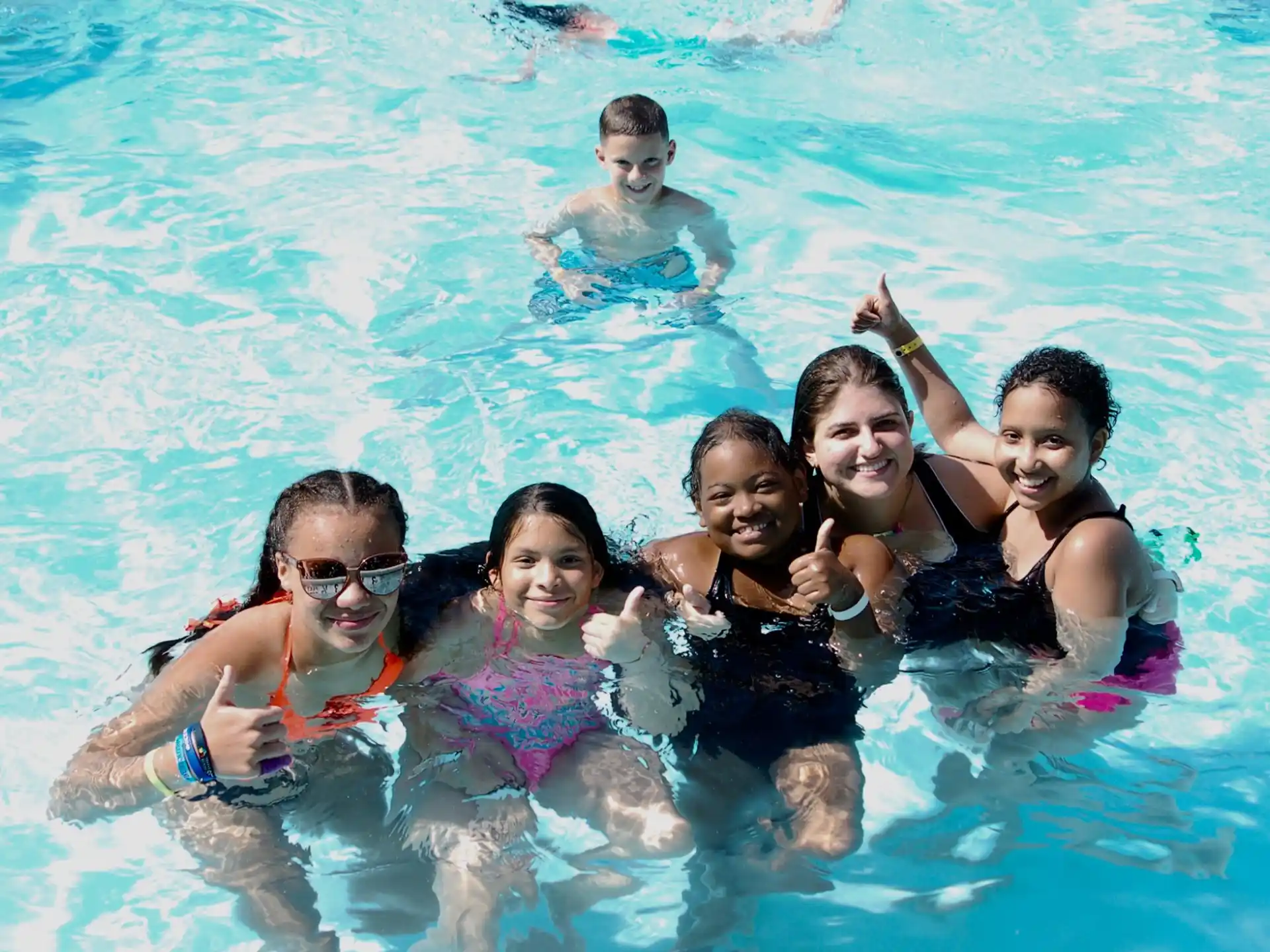 a group of people in a pool