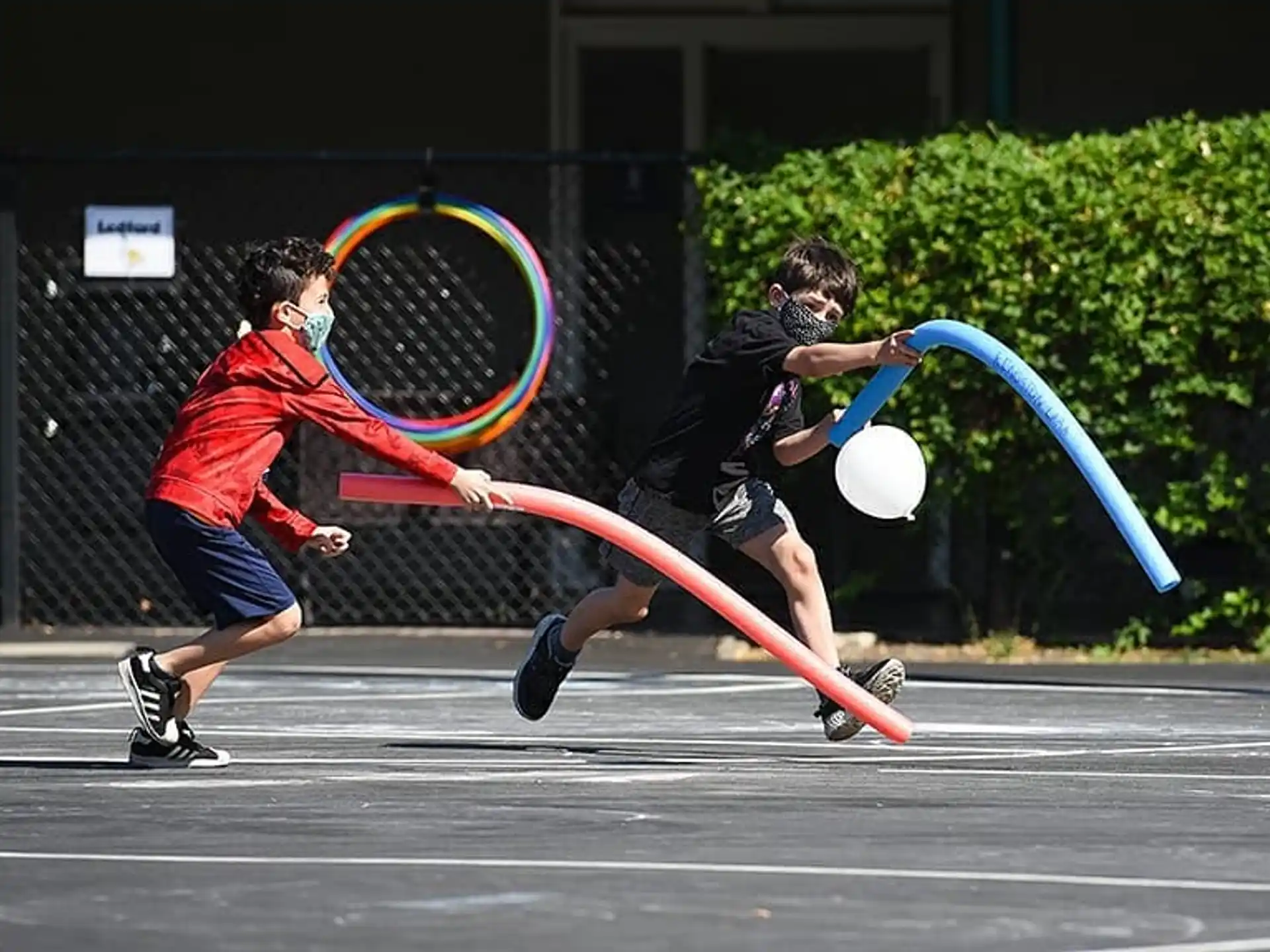 a couple of people playing ping pong