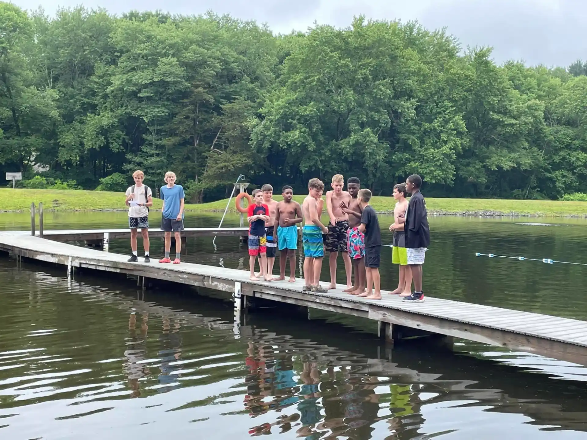 a group of people standing on a dock