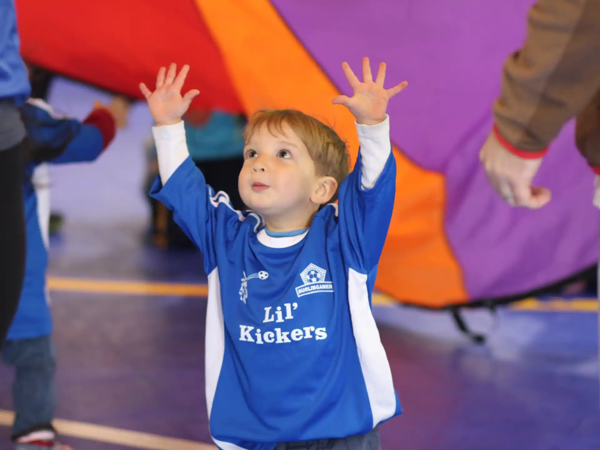a boy in a blue shirt