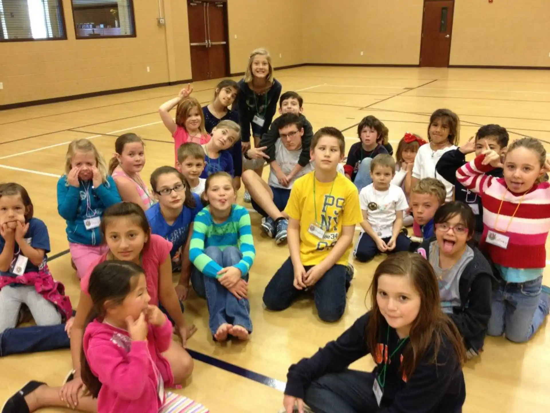 a group of children sitting in a circle
