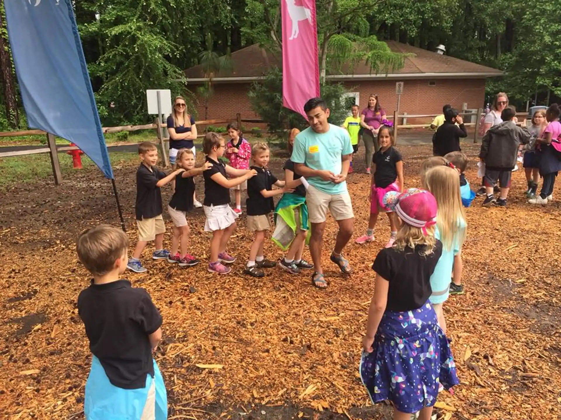 a group of people playing in a yard