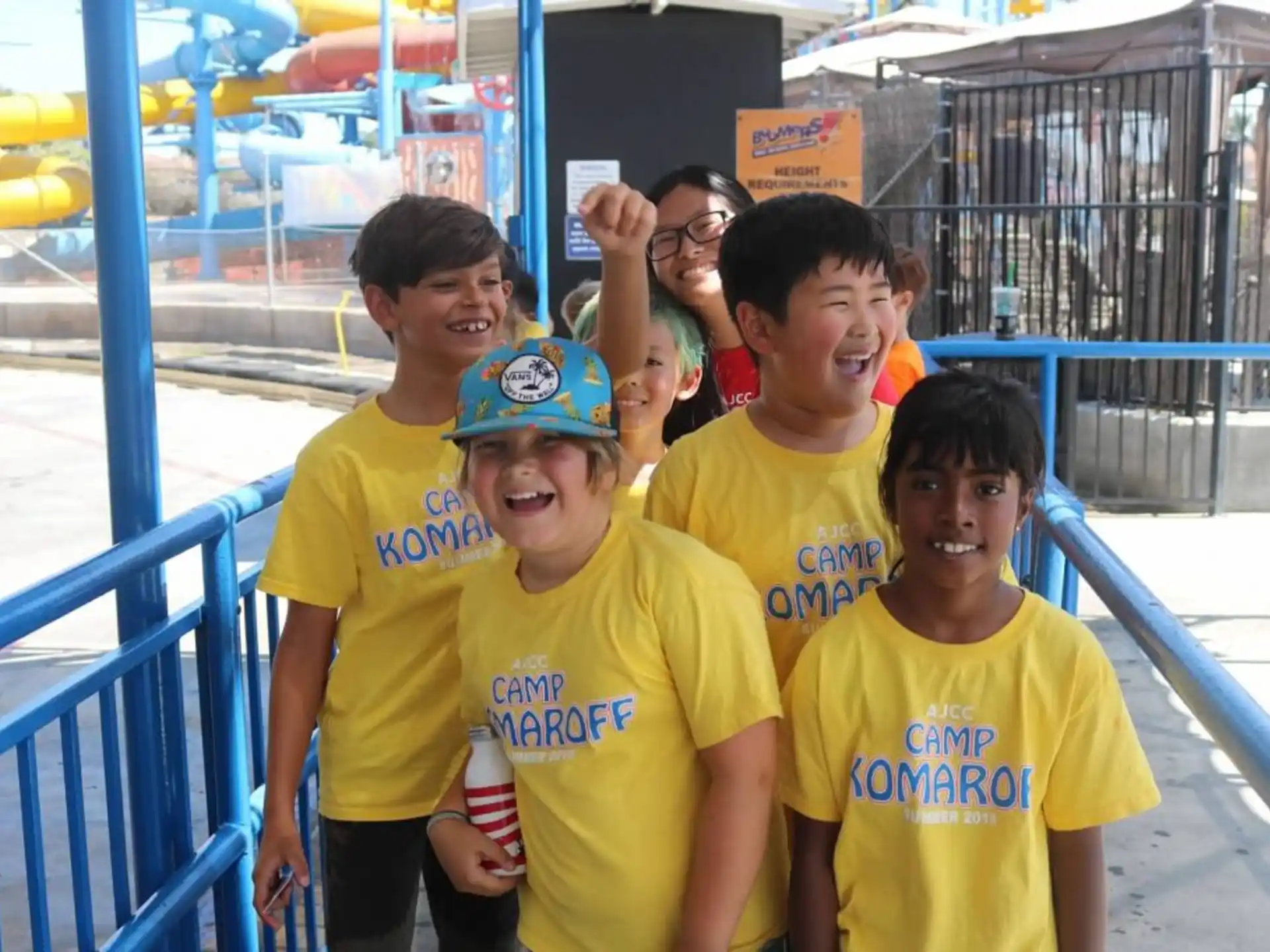 a group of boys in yellow shirts