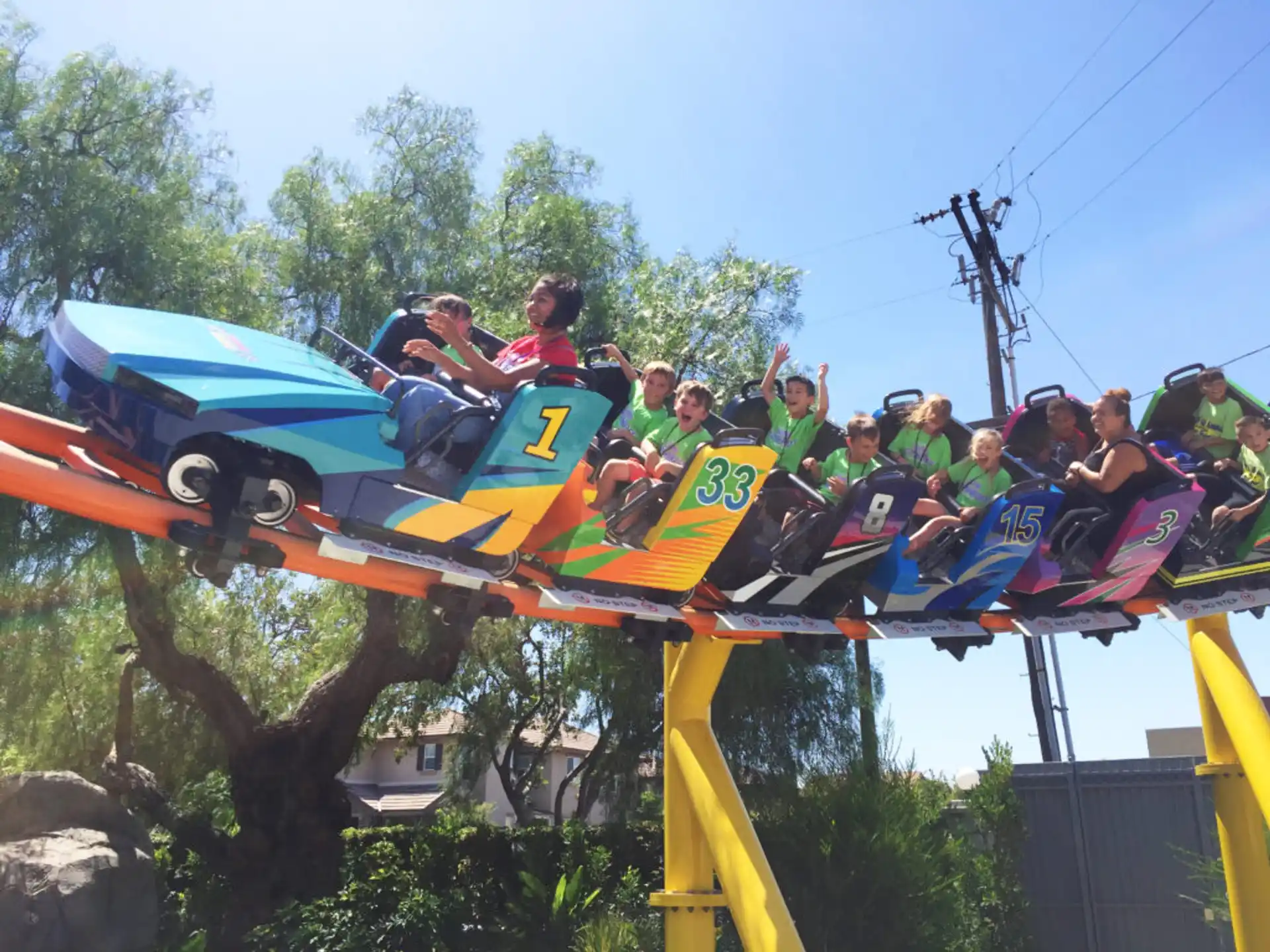a group of people riding a roller coaster