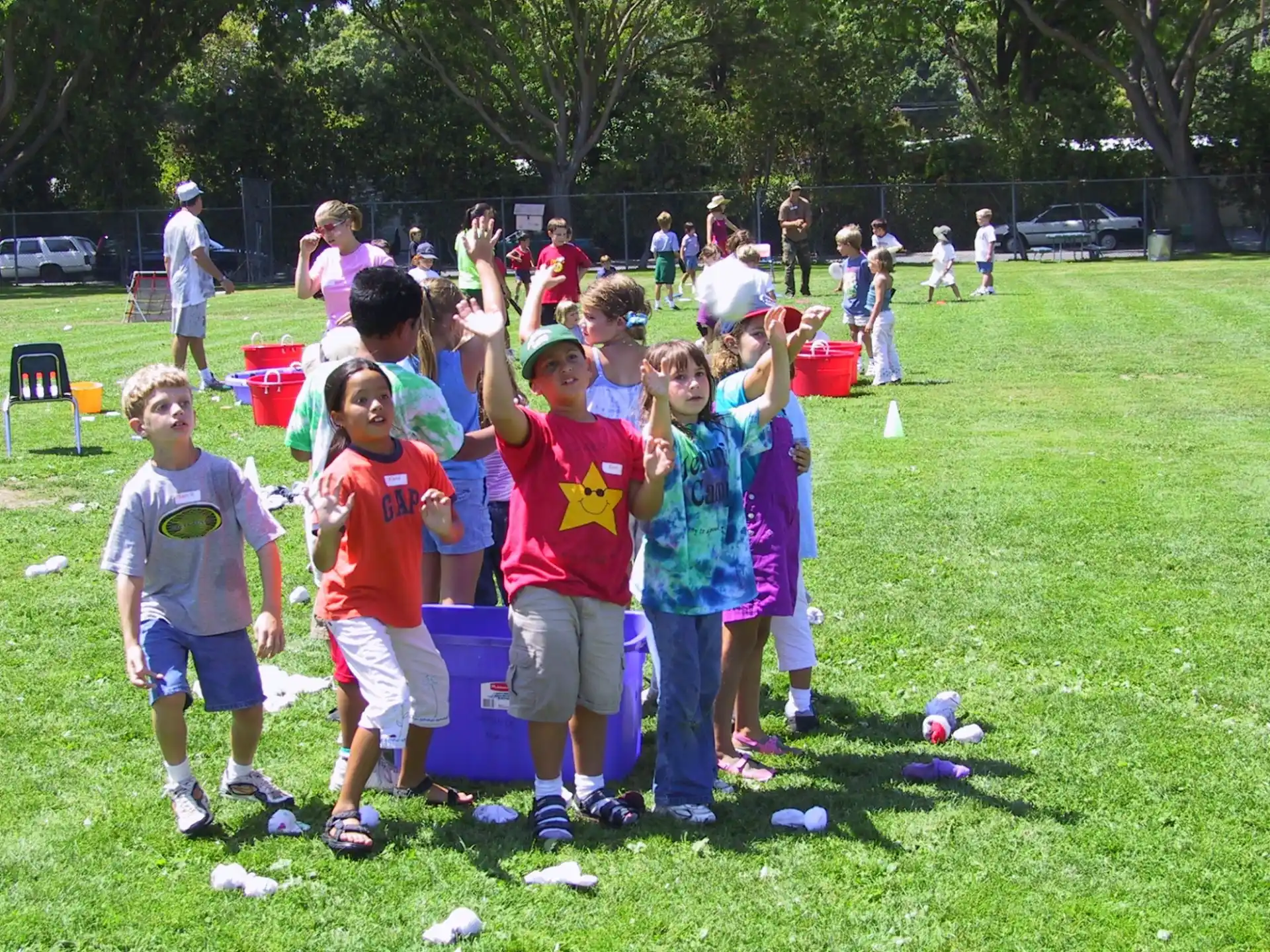 a group of children playing with balls
