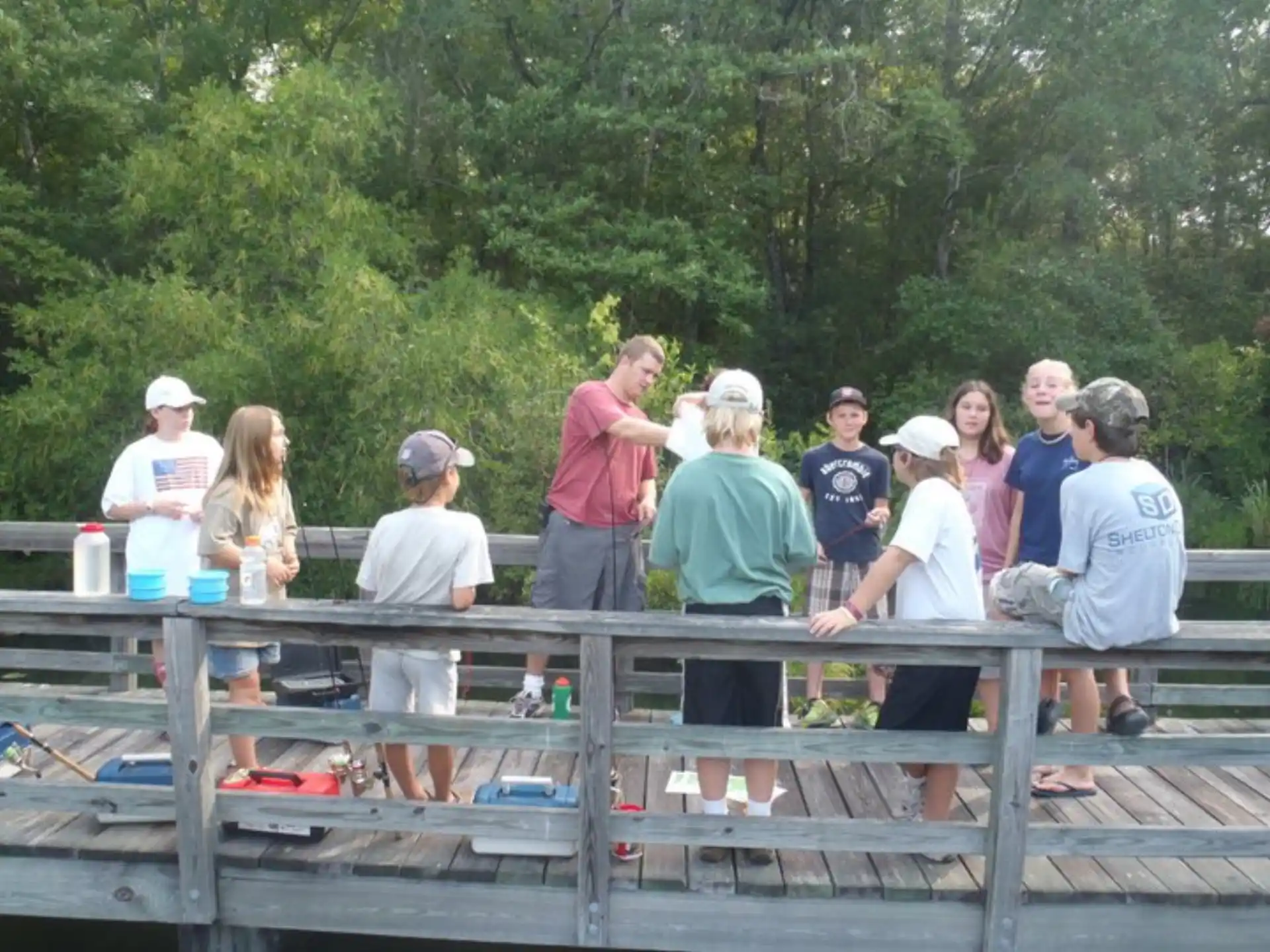 a group of people standing on a bridge