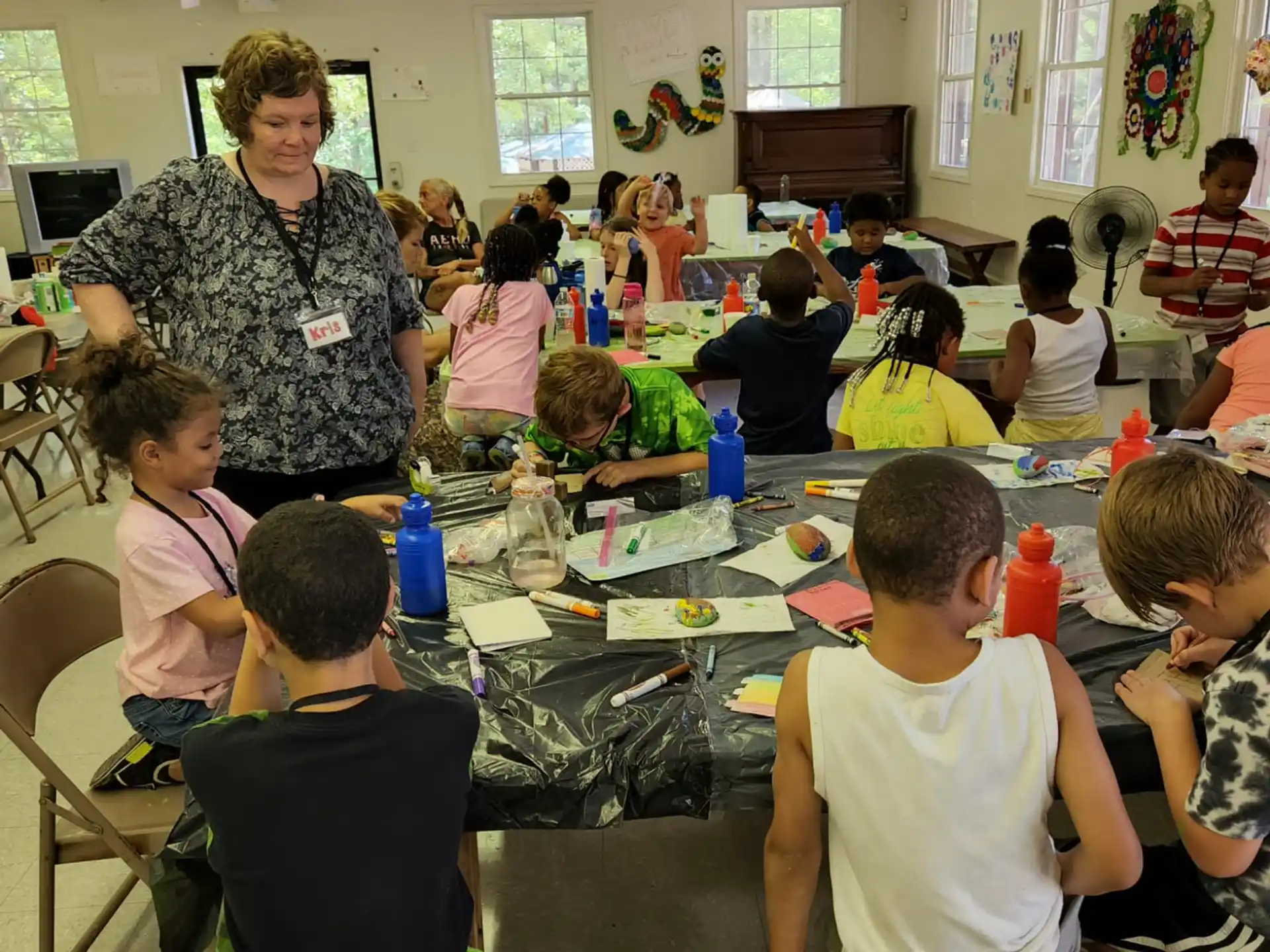 a person teaching children in a classroom