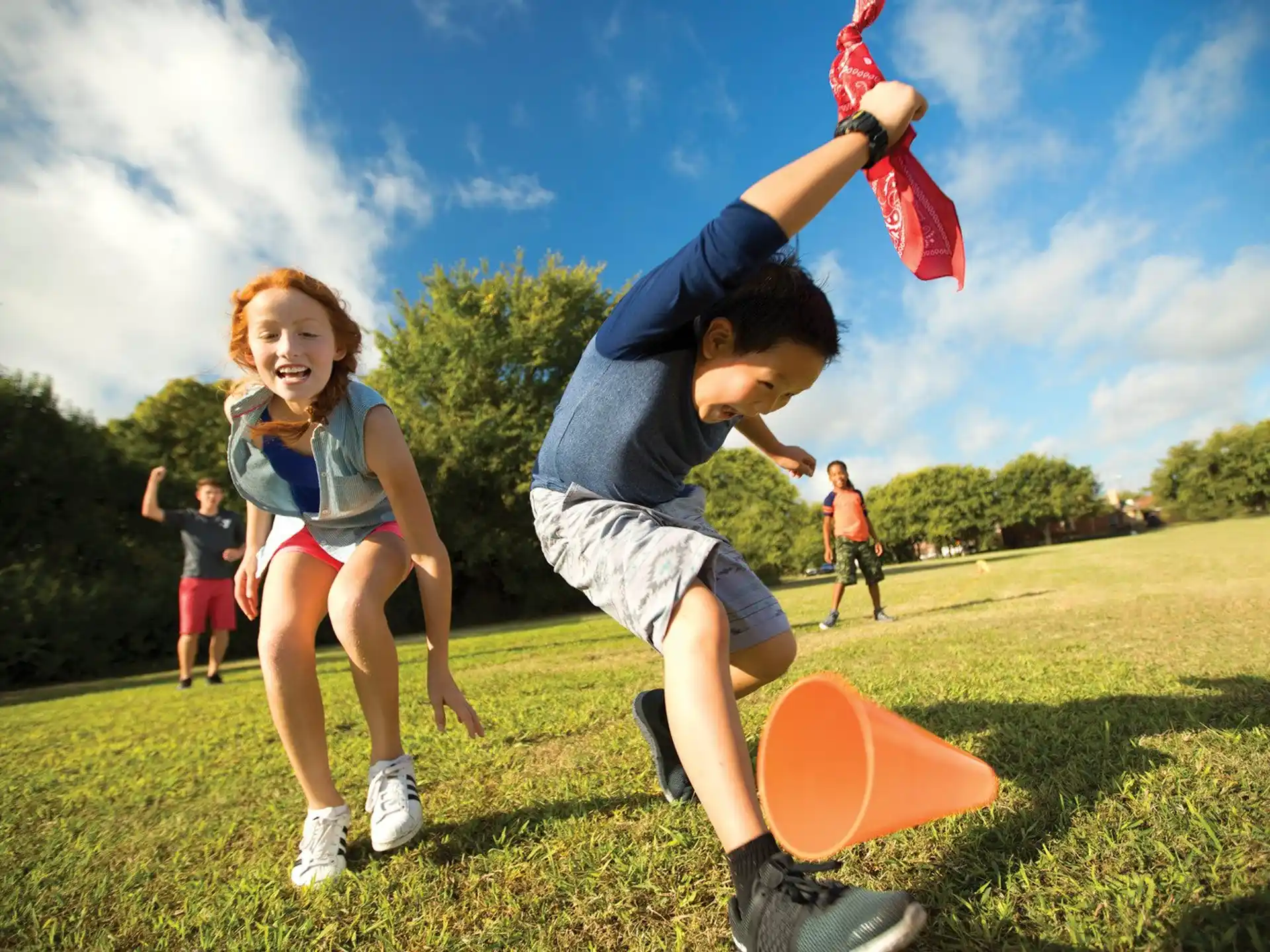 a man and a woman playing with frisbees