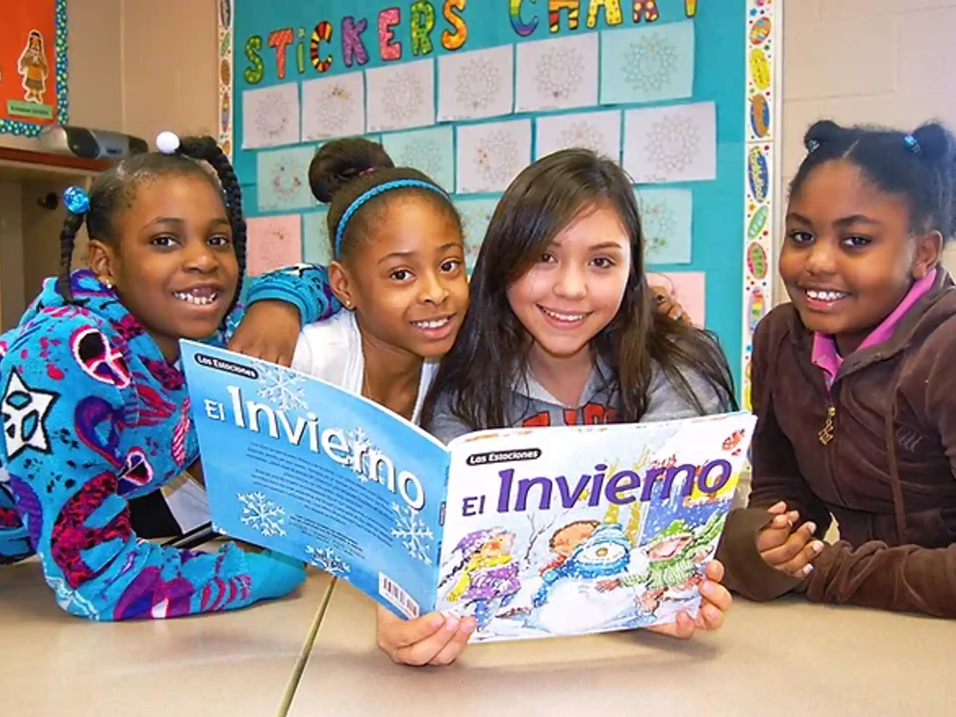 a group of girls holding up signs