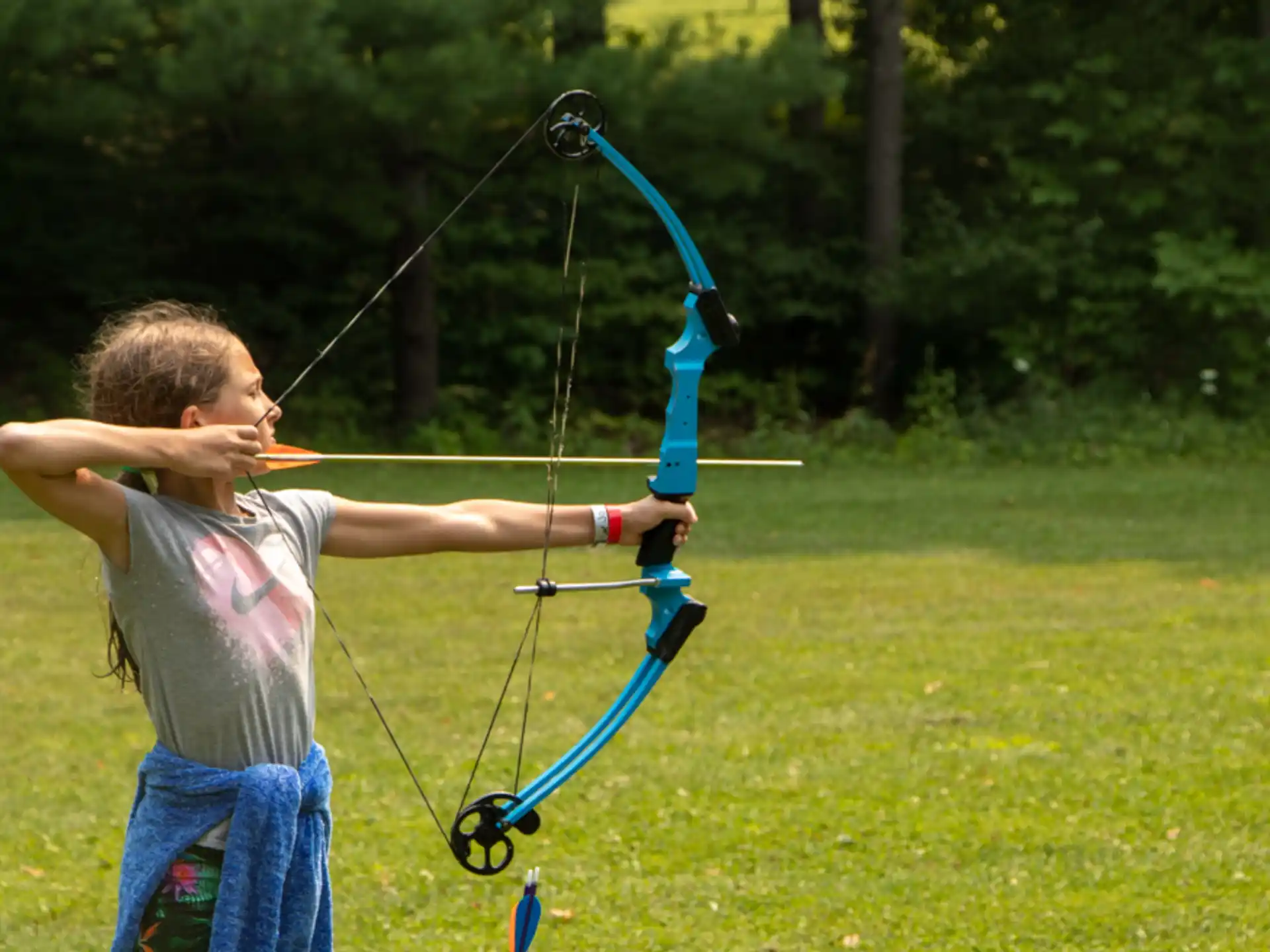 a boy shooting a bow